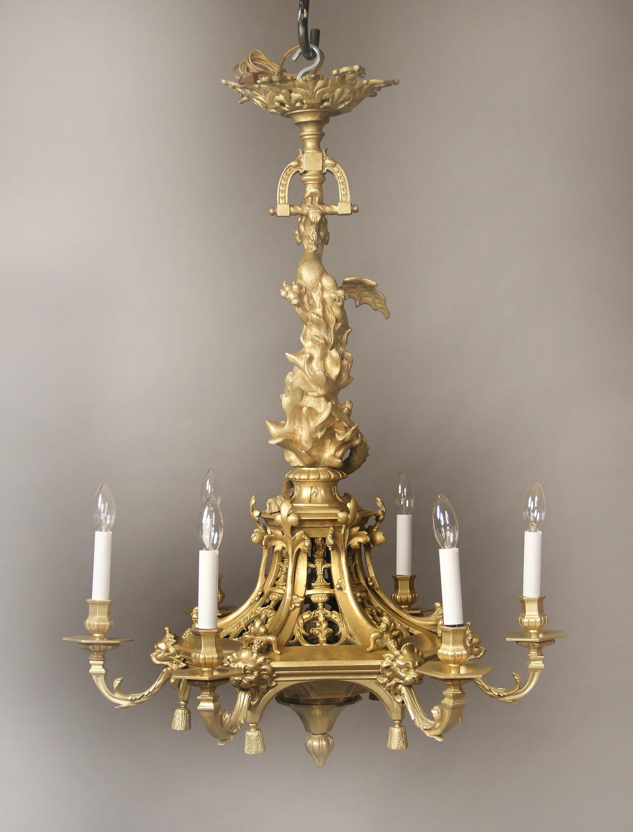 An interesting late 19th century gilt bronze six-light chandelier

The neck designed as a dragon flying through flames, lion masks leading into six perimeter lights.

If you are looking for a chandelier, a lantern or sets of sconces, Charles