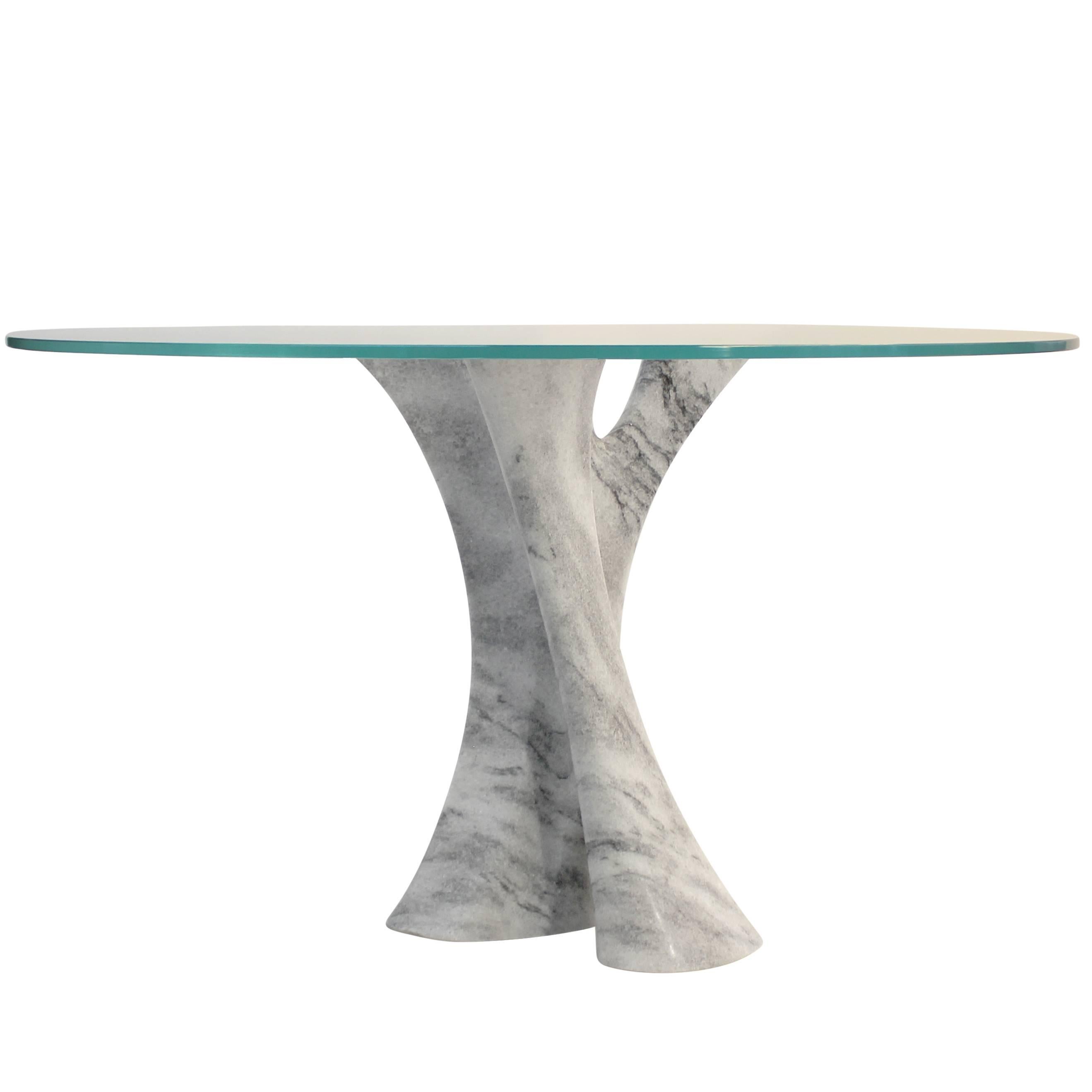 Interface carved solid marble block dining table with glass top. For Sale