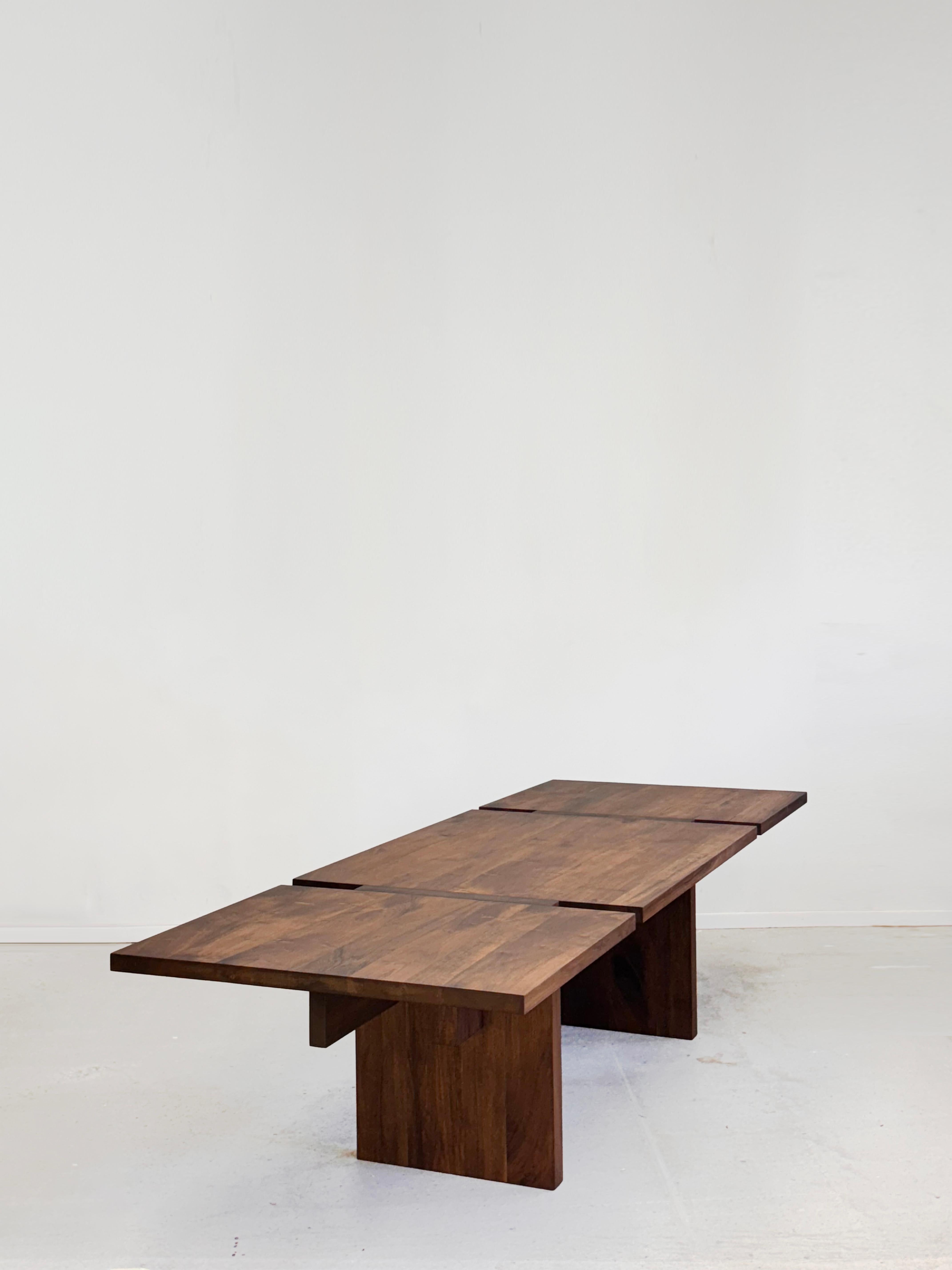 Interference Table by Dirk Meylaerts
Dimensions: W 120 x D 400 x H 74 cm
Materials: Walnut.

Also available in different dimensions. Please contact us. 

The slits between the three boards of the tabletop allow an interference between the sleek