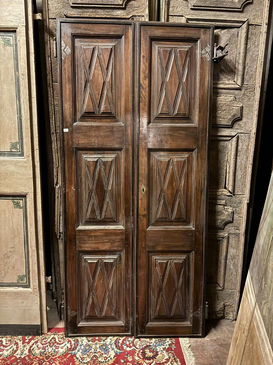 18th Century and Earlier Interior double-leaf walnut door, panels carved with geometric shapes, Italy For Sale
