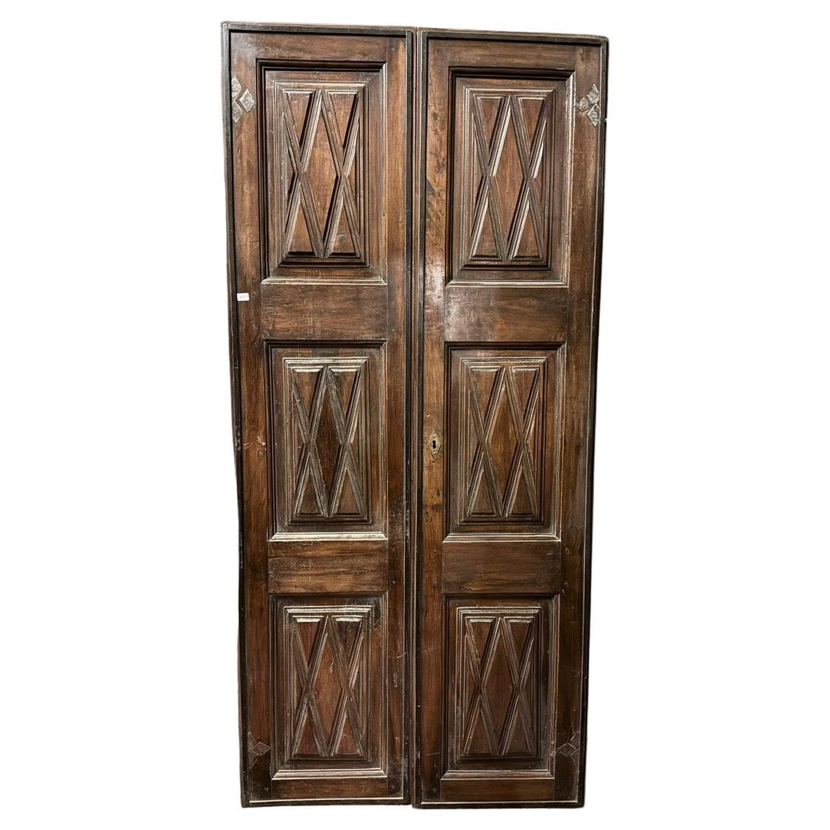 Interior double-leaf walnut door, panels carved with geometric shapes, Italy For Sale