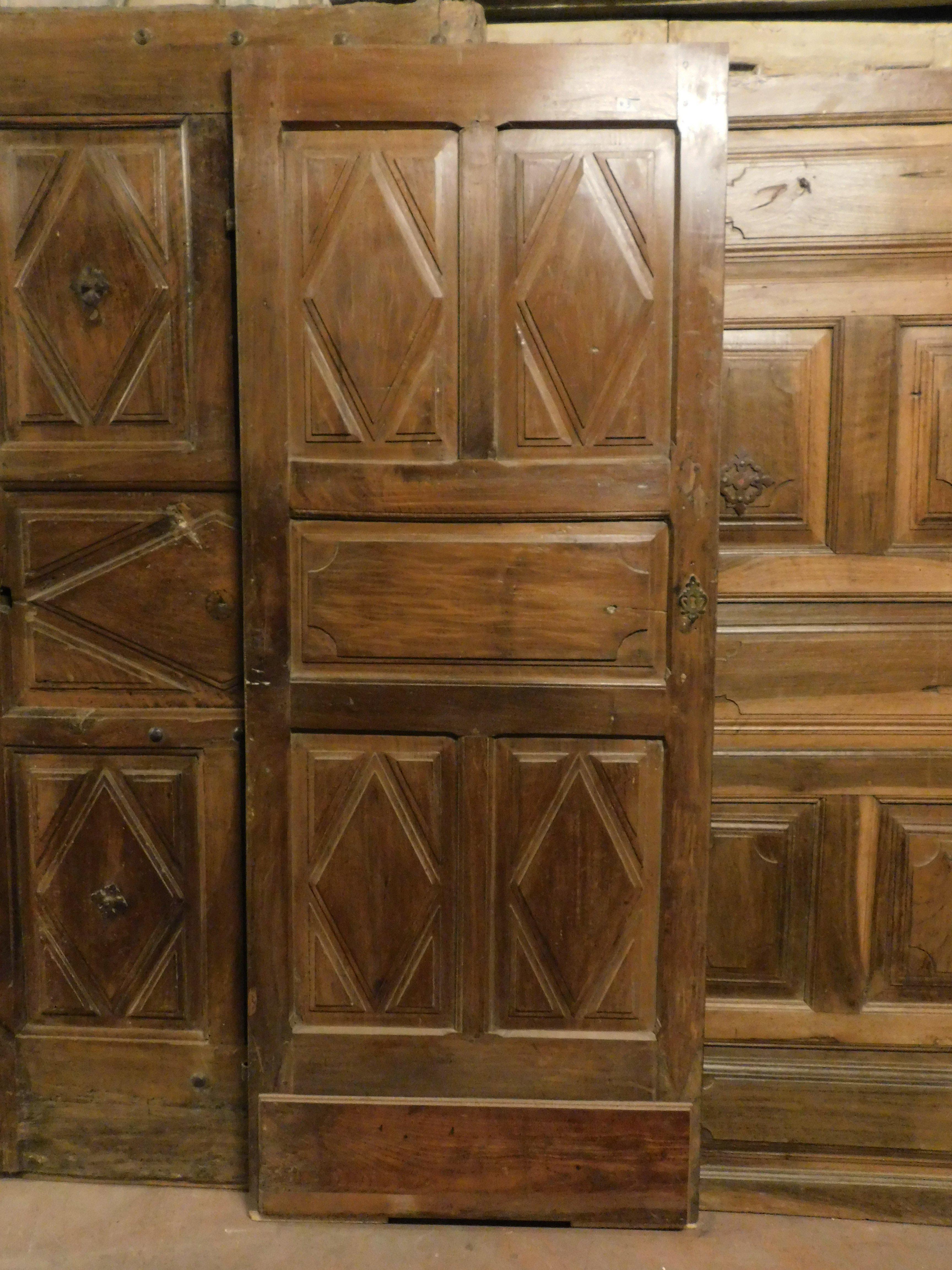 Italian Interiornal old door, in walnut, richly carved on both sides, Milan (Italy) For Sale