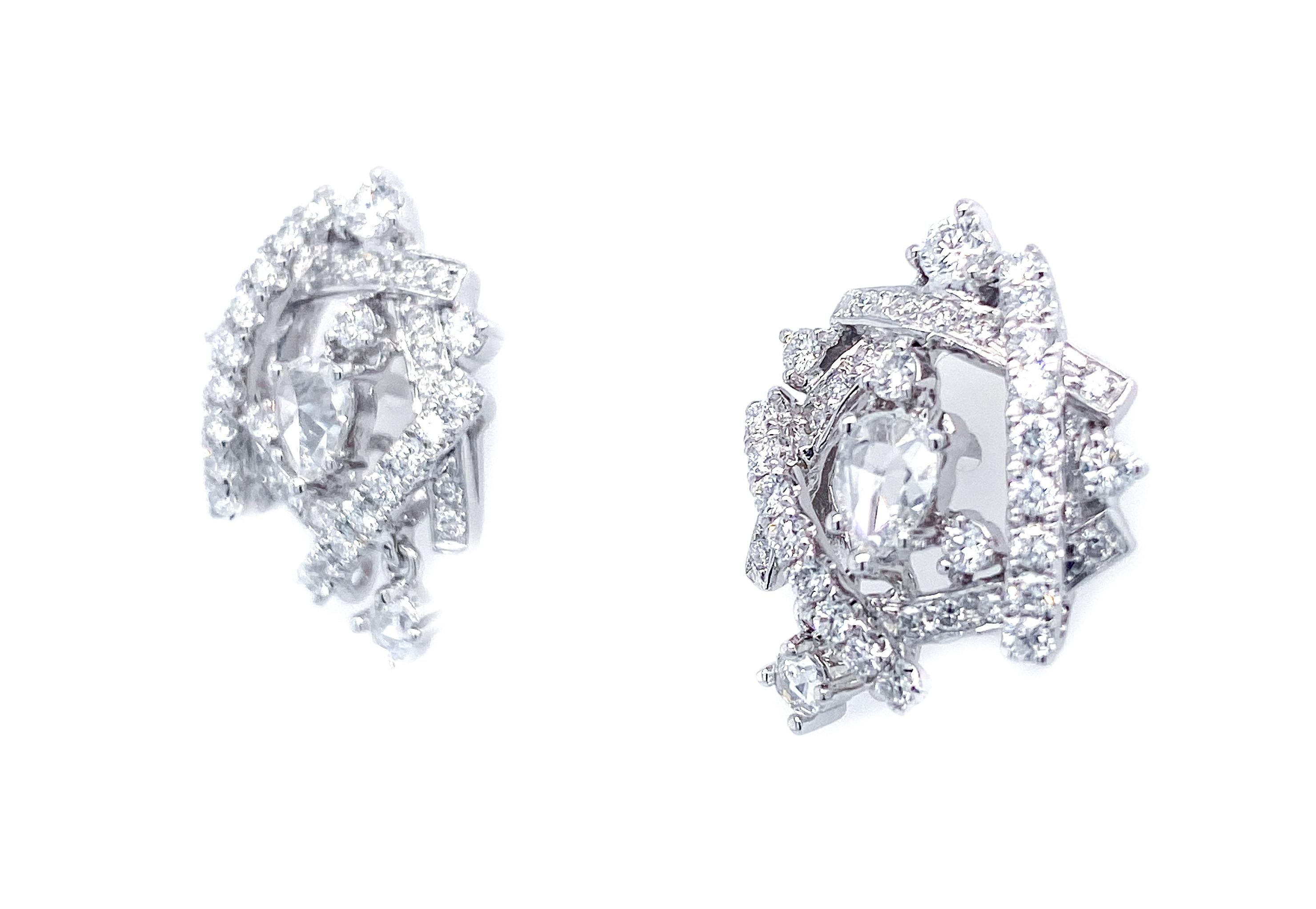 An artful yet extremely refreshing design of 72 interlacing round diamonds, totaling .83 carat, and 4 clear and clean old cut diamonds, totaling .41 carat. These beautifully wearable earrings also brings an element of liveliness, with a diamond
