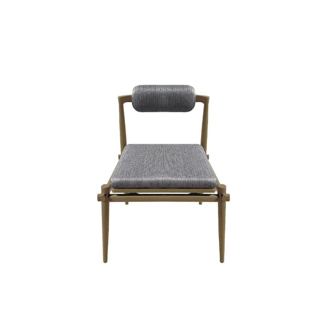 Description: Interlock Chair Armless - our signature dining chair with a nod to traditional interlocking timber furniture. crafted in solid ash, the chair is adorned with intricate detailing and highly poetic profiles.

