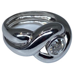 Interlocking Band Ring in 18 Carat Gold Set with a Diamond 0.80 Carat