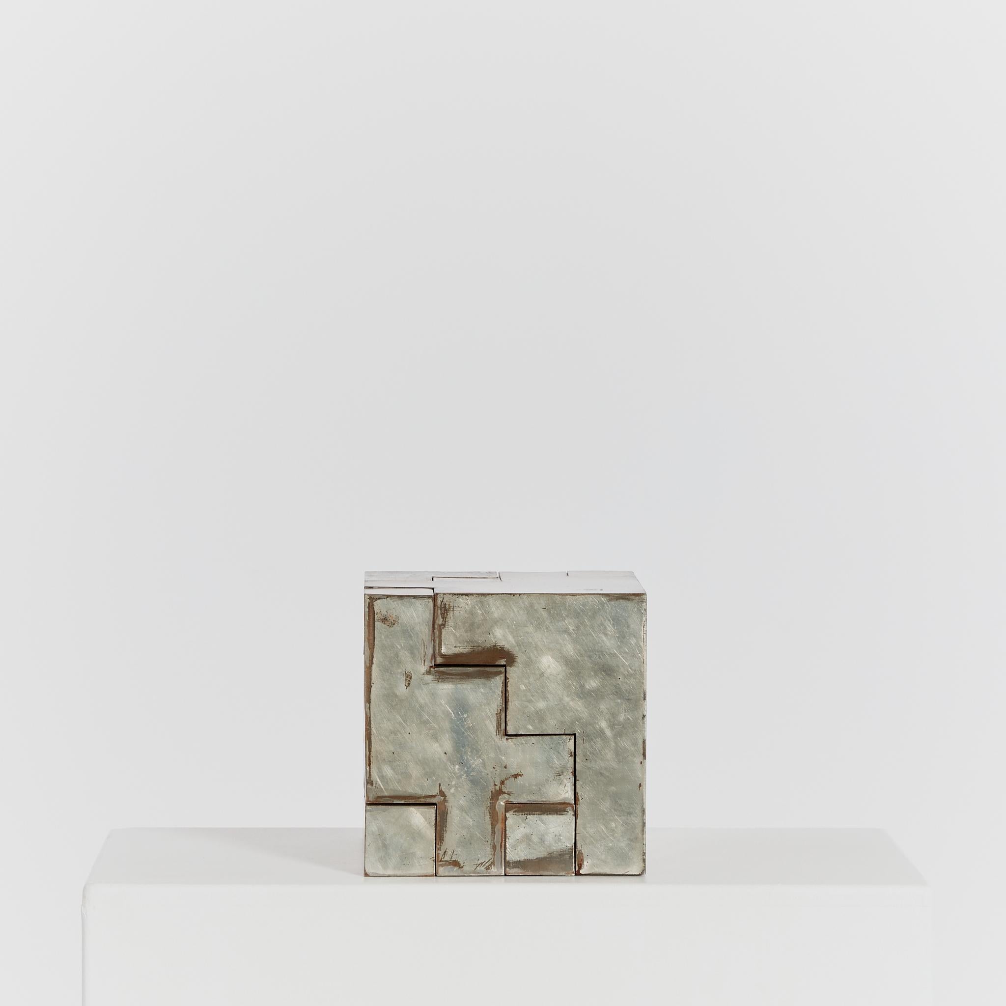 Sculpture made from a trio of separate interlocking parts that form a perfect cube. A versatile piece due to the multiple arrangements possible and showcasing a worn patina complimentary of the design.

Origin: The Netherlands

Period: circa