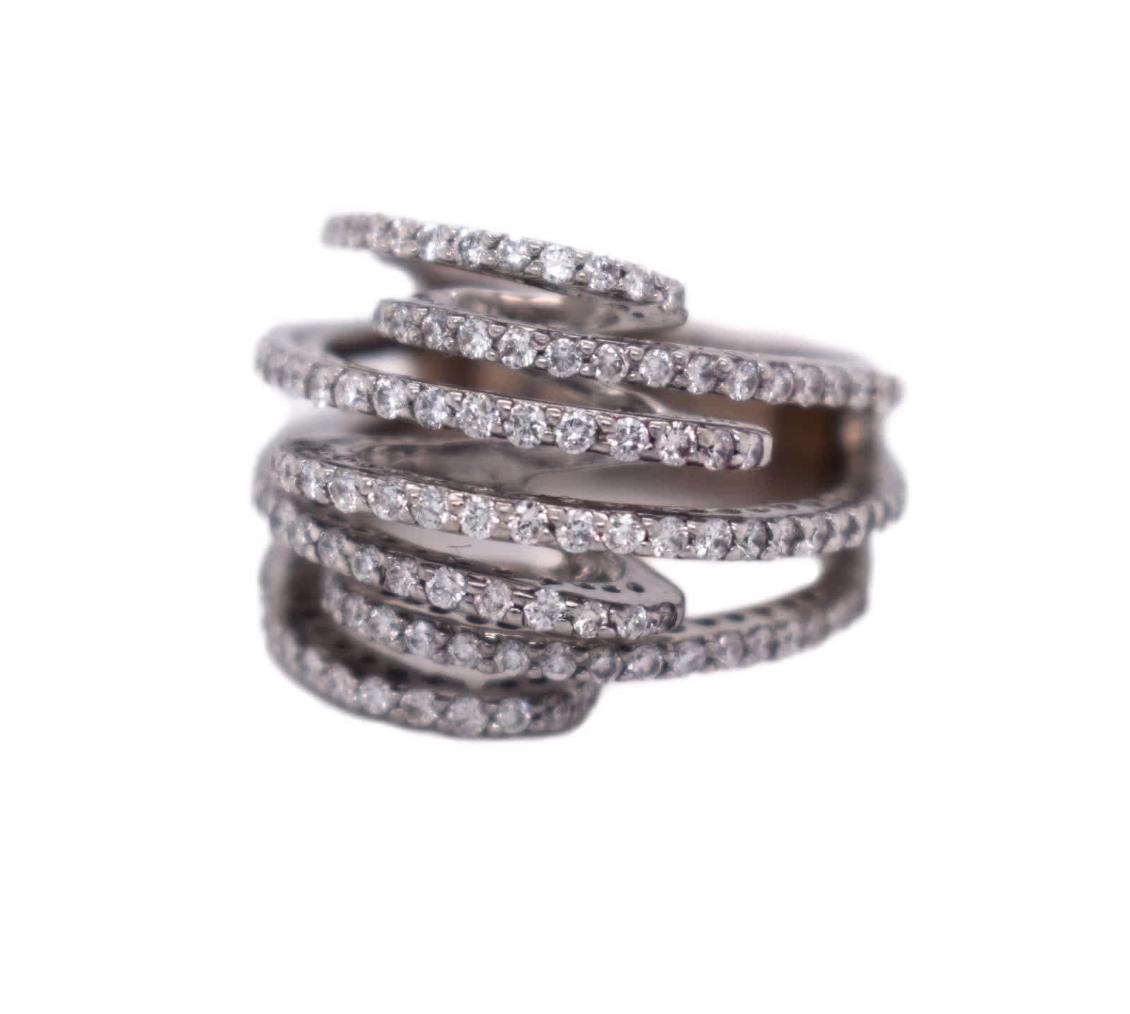 Ring Size:  6 (Sizable)

Style: Cocktail Ring 

Material: White Gold 

Metal Purity: 18K

Stone: Diamonds

Band width: 17.17 mm (at highest) x 7.18 mm (at it's end)

Total Item Weight (g): 10.39g 

Hallmarks:  18k D 1.05

Includes: 24 Month