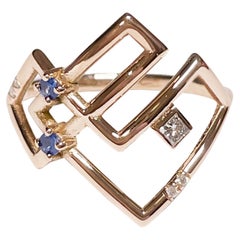 Interlocking Geometry Ruby and Diamond 18 Karat Rose Gold Ring