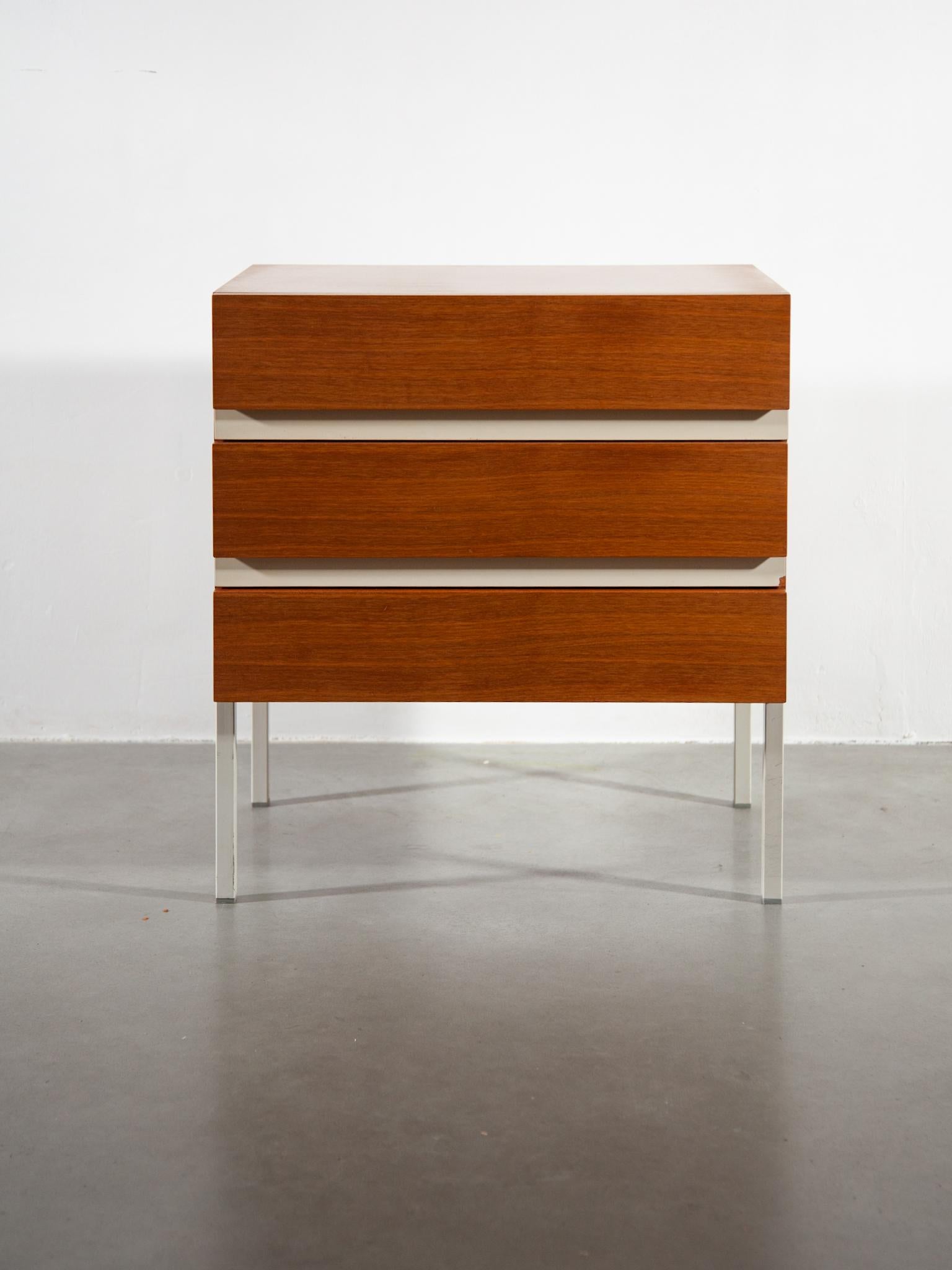 Side table in cherrywood and lacquered white laminate, three drawers, West German manufacture INTERLUBKE, 1970s. Perfect stability and in original perfect condition.
