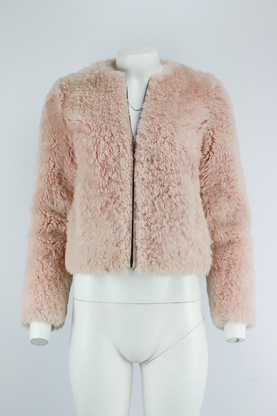Intermix suede trimmed shearling jacket. Pink. Long sleeve, crewneck. Zip fastening at front. 100% Leather; lining: 100% polyester. Size: XSmall (UK 6, US 2, FR 34, IT 38). Shoulder to shoulder: 15 in. Bust: 35 in. Waist: 35 in. Hips: 36 in. Length: