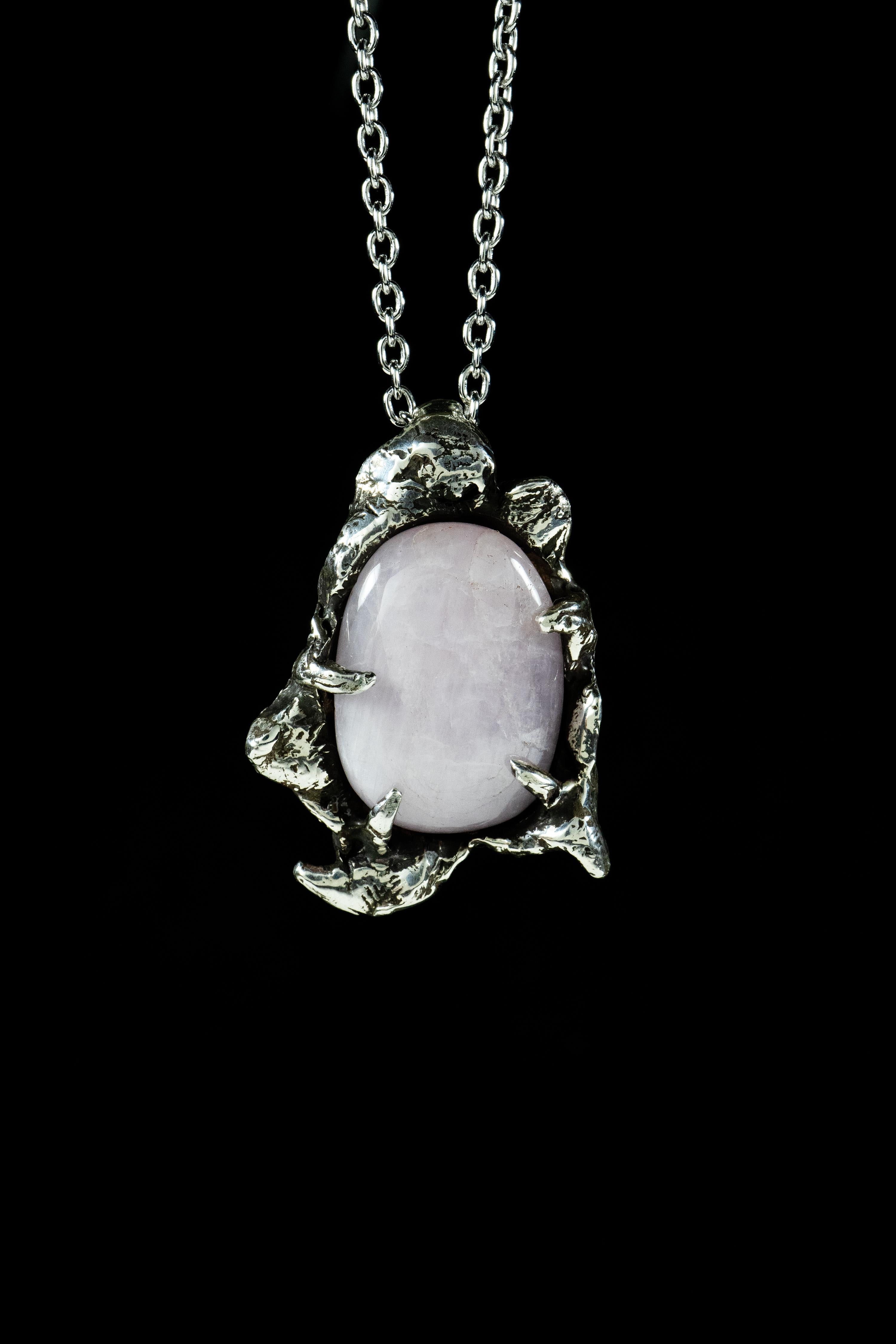 Internal is a one-of-a-kind pendant by Ken Fury that is hand-carved and cast in sterling silver and features a natural Rose Quartz stone.

Size of piece: 35mm x 24mm

Hand-signed

Includes a 24-inch sterling silver chain.