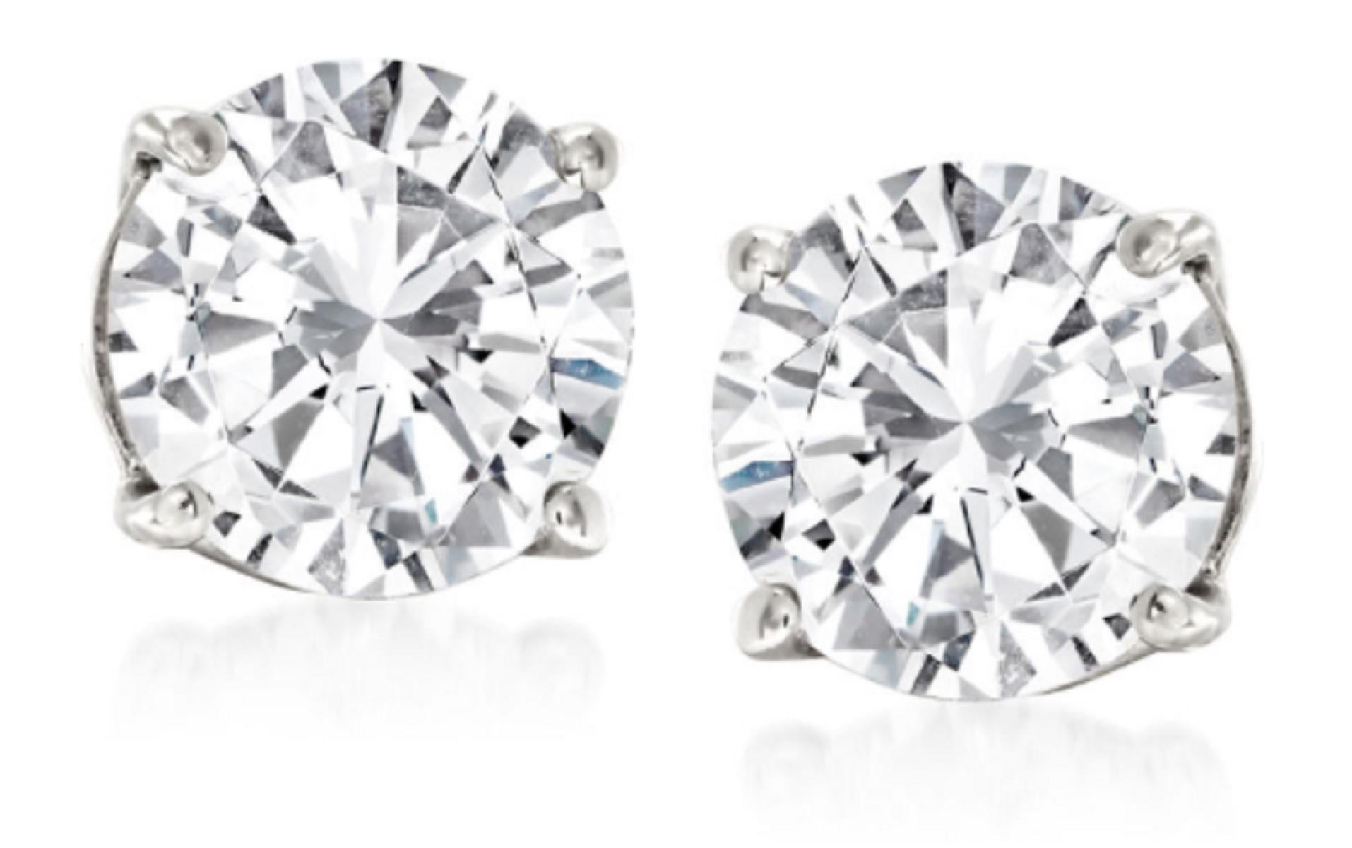 A perfect pair of 3.03 carat brilliant cut diamond studs
