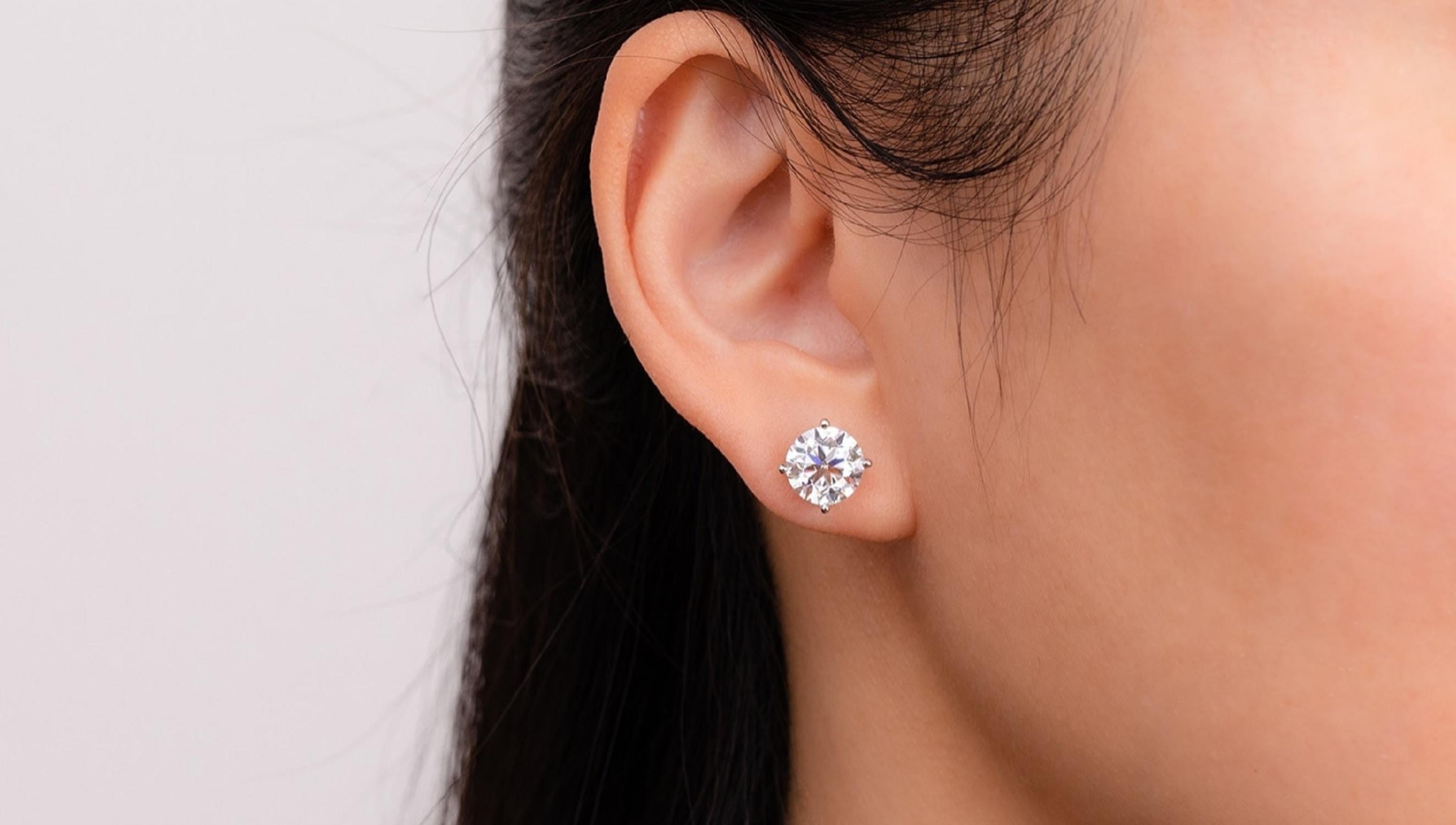 An exquisite pair of brilliant cut diamond studs. This diamonds are 100% eye clean full of life and sparkle and white in color
