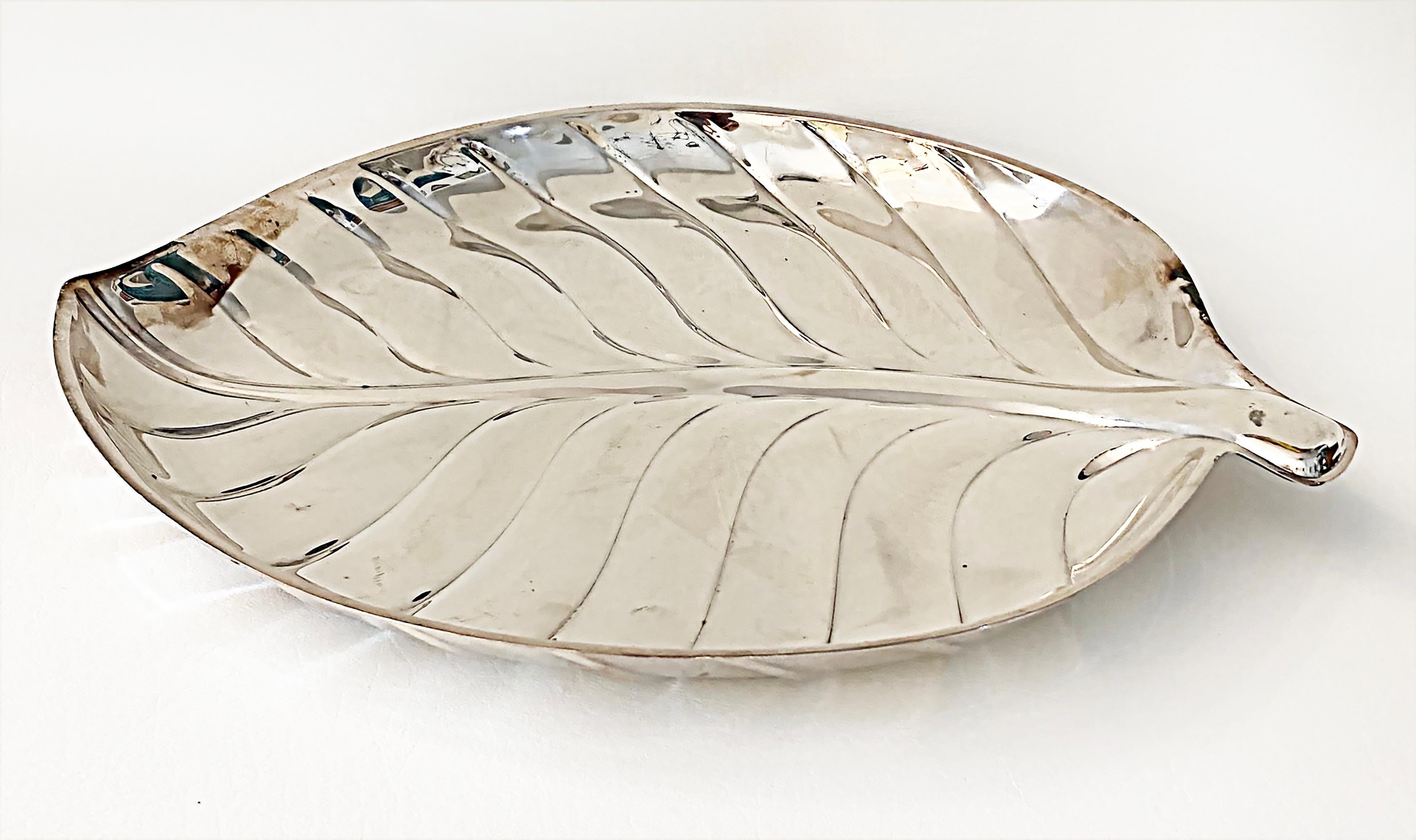 International Silver Leaf Plated Serving Tray, Mid-Late 20th Century, #8199

Offered for sale is a silver plate leaf serving tray by the International Silver Company model #8199 dating to the mid-late 20th century. The tray is in good vintage