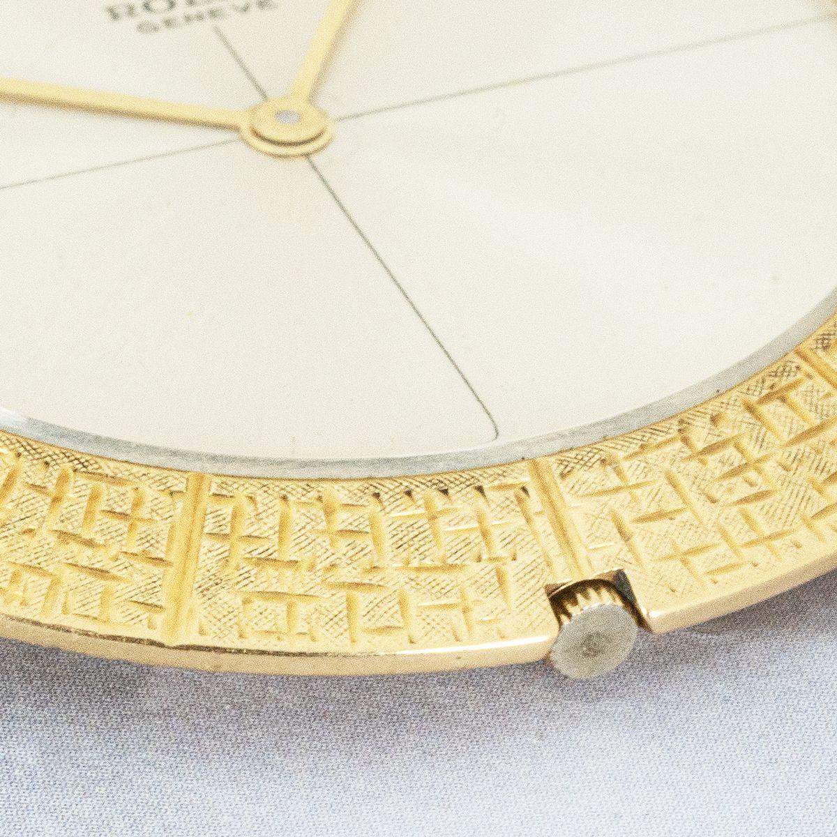 Rolex. A Rare 18ct Yellow Gold Dress Watch With Original Presentation Box C1964.

Dial: The simplistic silver dial with quadrant lines fully signed Rolex Geneve with Rolex Crown at twelve o'clock and original slim stick hands.

Case: The elegant