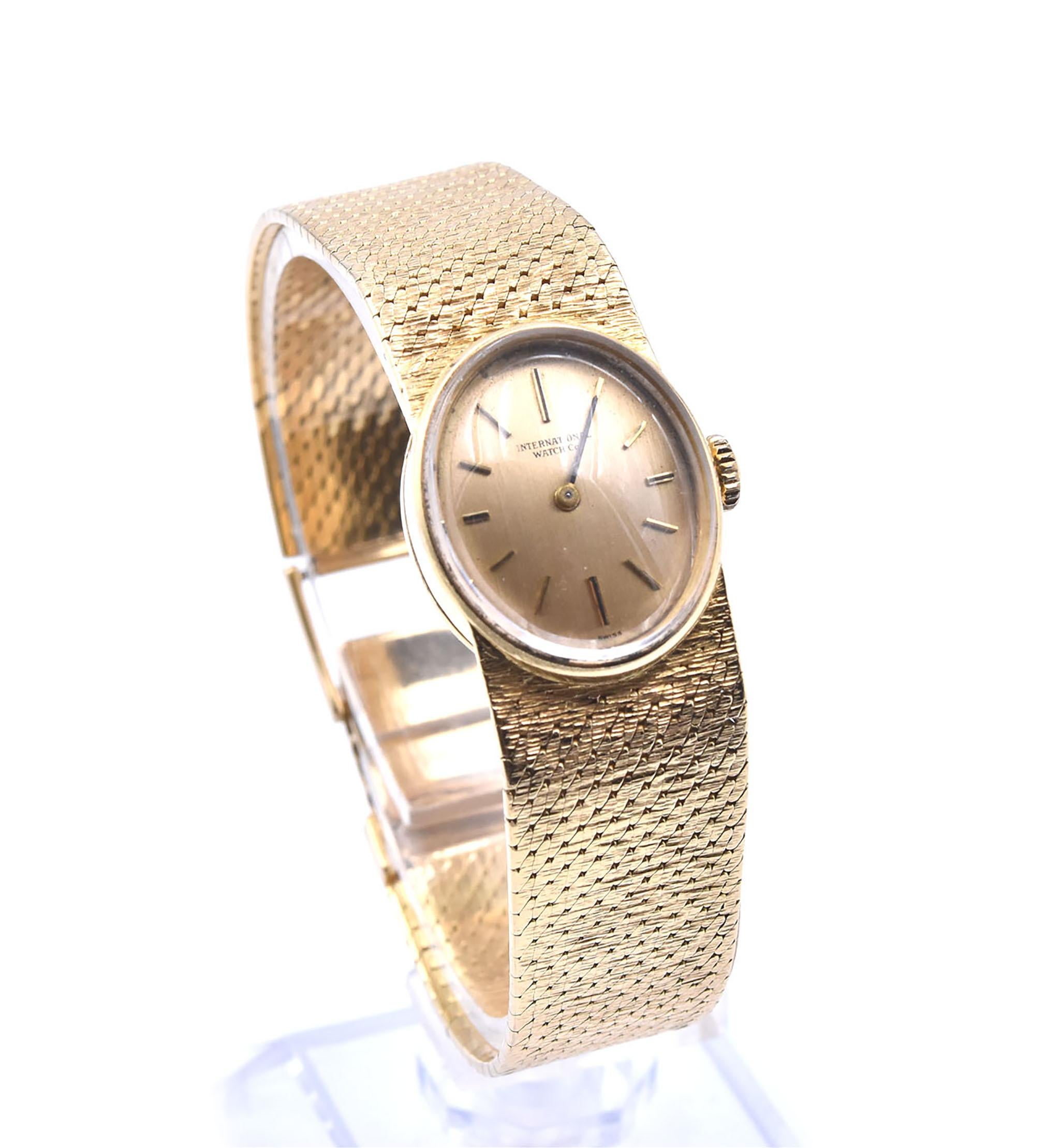 Movement: mechanical 
Function: hours, minutes
Case: 20.96mm by 17.62mm oval 18k yellow gold case, plastic crystal, pull/push crown
Band: 18k yellow gold mesh bracelet, fold down clasp, watch will fit a 6” wrist
Dial: gold dial with gold hour stick