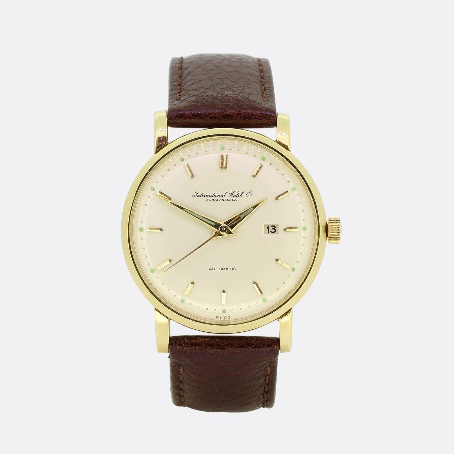 This is a vintage 18ct yellow gold watch from the designer IWC. The watch features gold hour markers and gold hands. The watch case has been crafted in 18ct yellow gold with Patek style lugs and a brown crocodile effect leather strap. This