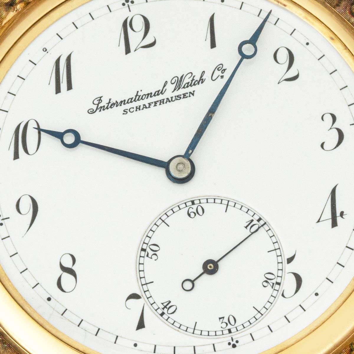 International Watch Company. Reloj de bolsillo de esfera abierta y palanca sin llave, oro amarillo de 18 ct, años 20 del siglo XX.

Esfera: Una hermosa esfera de esmalte blanco en perfecto estado con números de estilo Breguet y marcas exteriores de