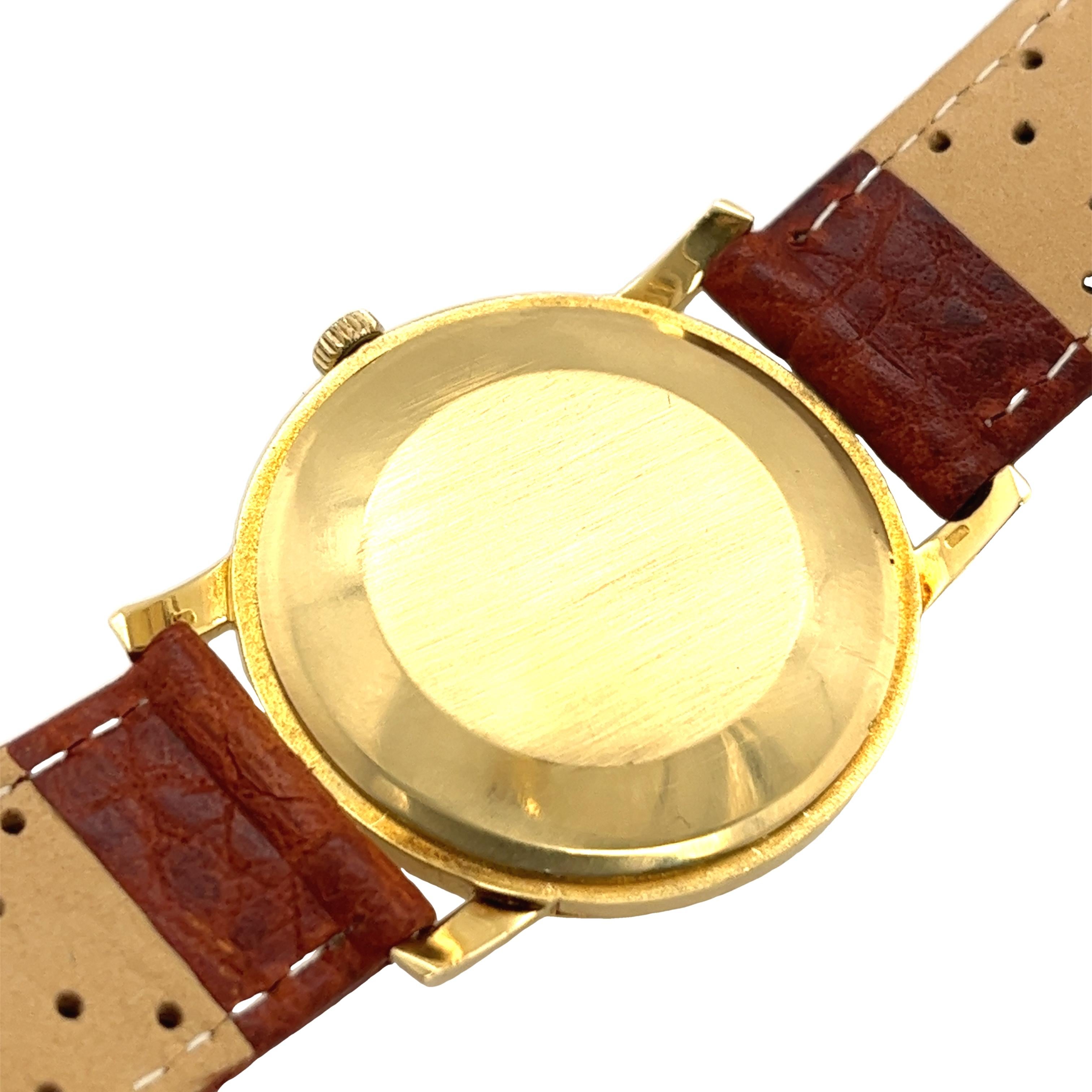 International Watch Company Manual Orologio meccanico vintage da uomo in oro giallo 18 ct con cinturino in pelle marrone da 33 mm, perfettamente funzionante.

Peso totale dell'orologio: 32.9 g
Numero di Serie: 1781763
Dimensioni della cassa: 33