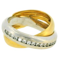 Anillo entrelazado de oro blanco y amarillo de 18k con diamantes