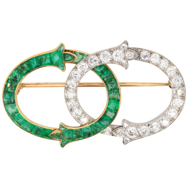 Intertwined Emerald and Diamond Brooch, French, by George Fonsèque, circa 1910s For Sale