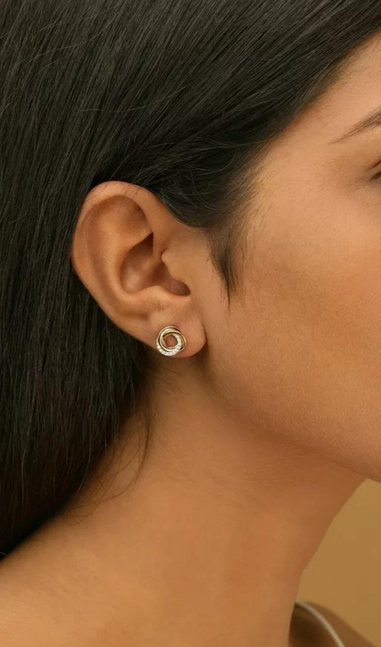 Intertwined Tri-Color Circle Earring 14k Solid Gold Diamond Anniversary Earring.
Light weight can be worn everyday

Additional information:
Base Metal: Rose Gold
Color: White
Country of Origin: India
Colored Diamond Intensity: Faint
Number of
