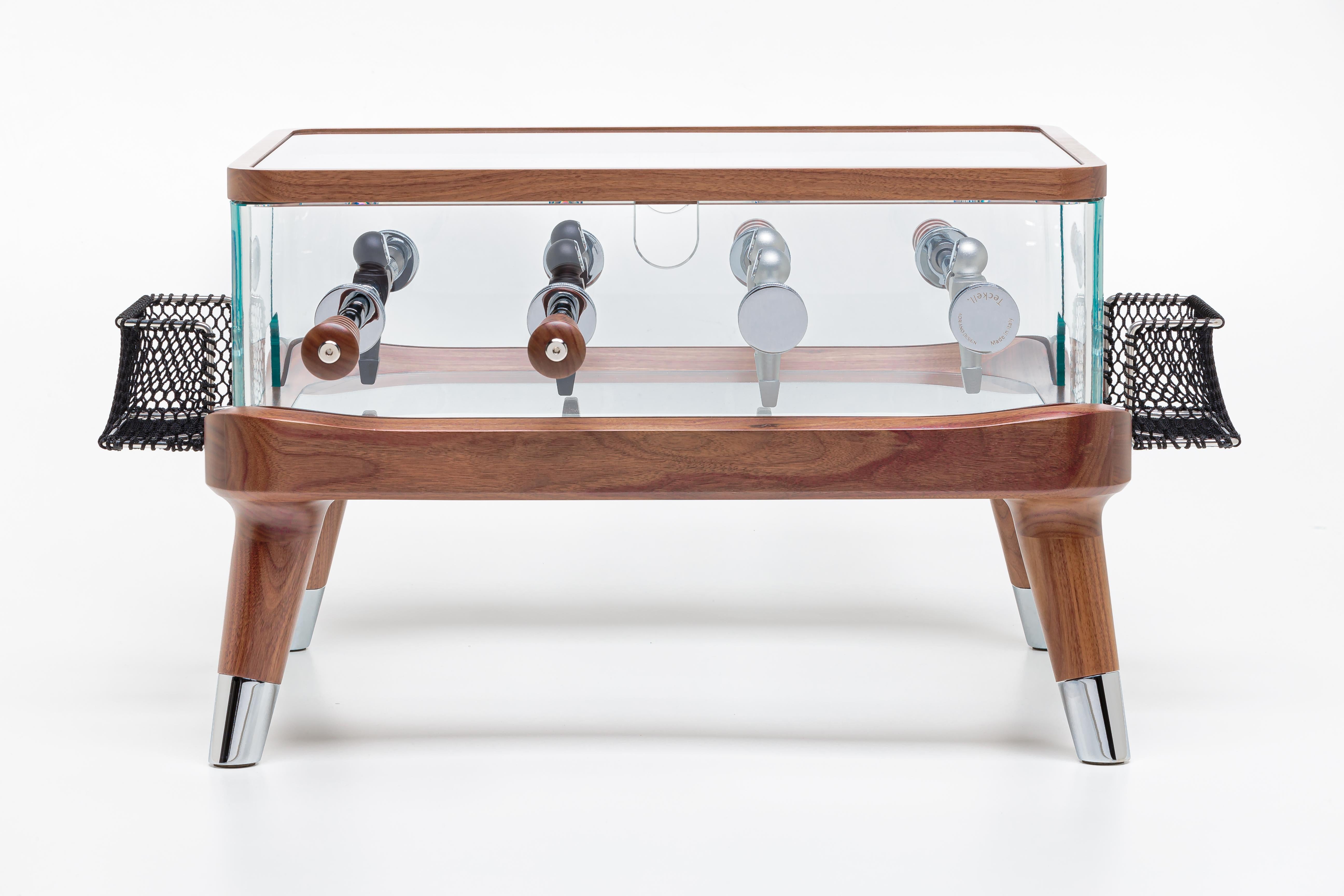 Intervallo is a luxury coffee table that blends elegance with playfulness. Featuring a solid Canaletto walnut structure and 15mm thick tempered glass perimeter, this unique piece replicates a mini foosball table. The aluminum players and handcrafted