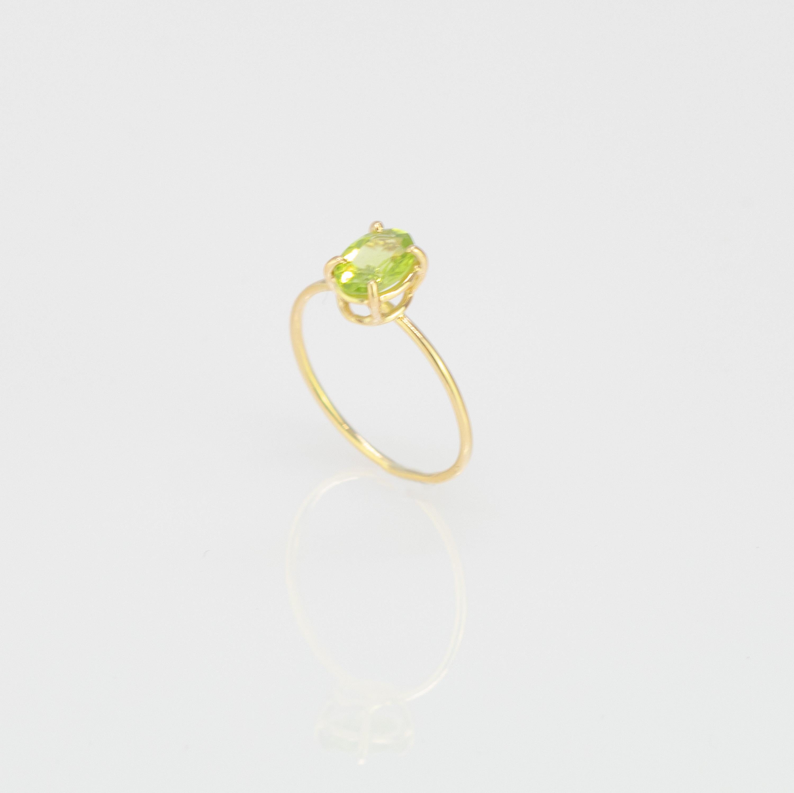 Oval cut solitaire ring design. 0.65 carats shining peridot on 18 karat yellow gold ring inspired by the colours of South Italy's Winter Trees. With a perfect size, it will fill with your daily elegant outfits.

inspired by the imposing French Alps