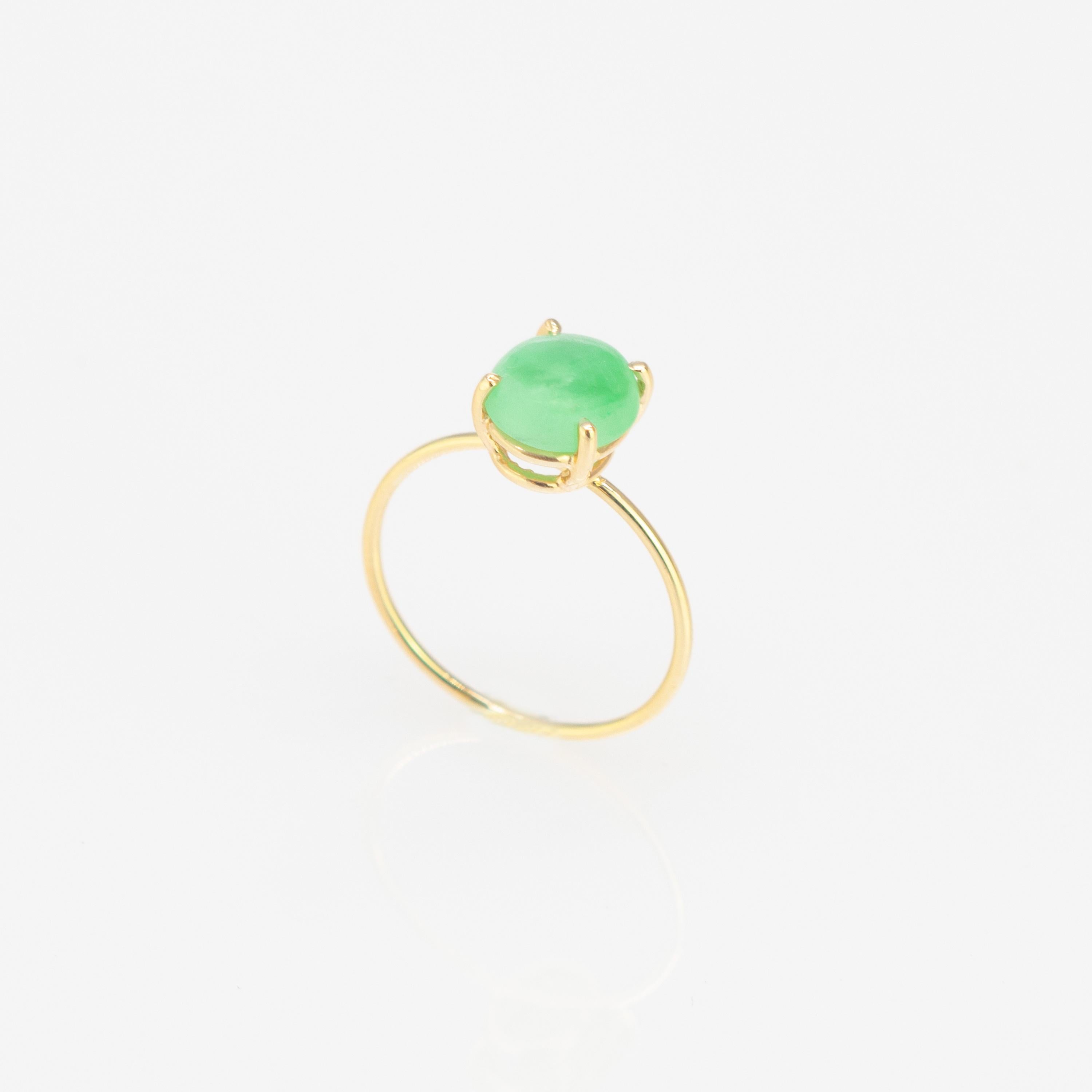 Oval cabochon cut solitaire ring design. 1.2 carats natural jade on 18 karat yellow gold ring inspired by the joy of summer sunsets. With a perfect size, it will fill with your daily elegant outfits.

This jewellery piece is inspired by its