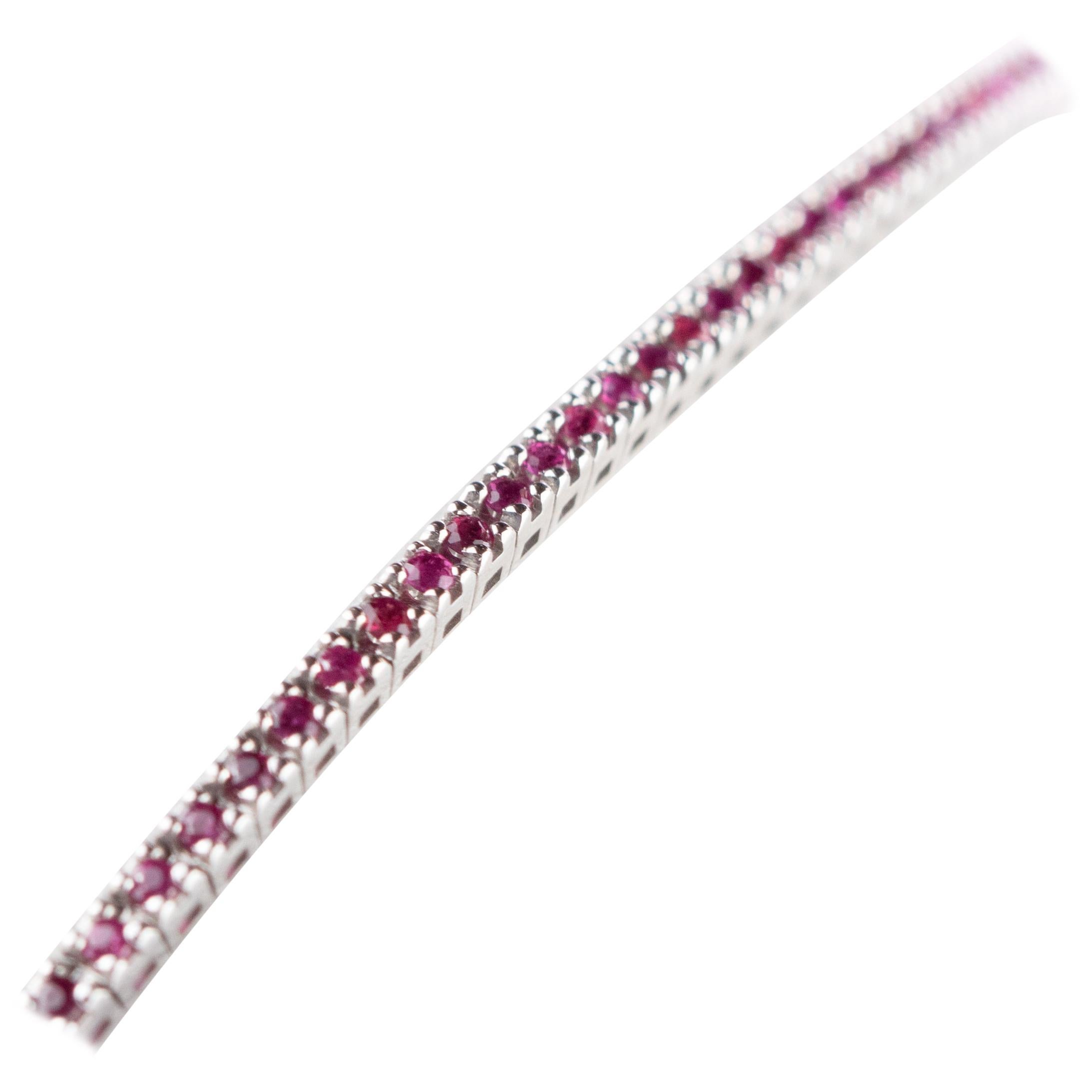 Iconic and stunning cocktail woven 1.30 carat ruby bracelet in an unforgettable design. 92 rubies create a tennis jewel surrounded by a 18 karat white gold piece for a royal personality.
 
This bracelet is inspired by the strength and passion of the