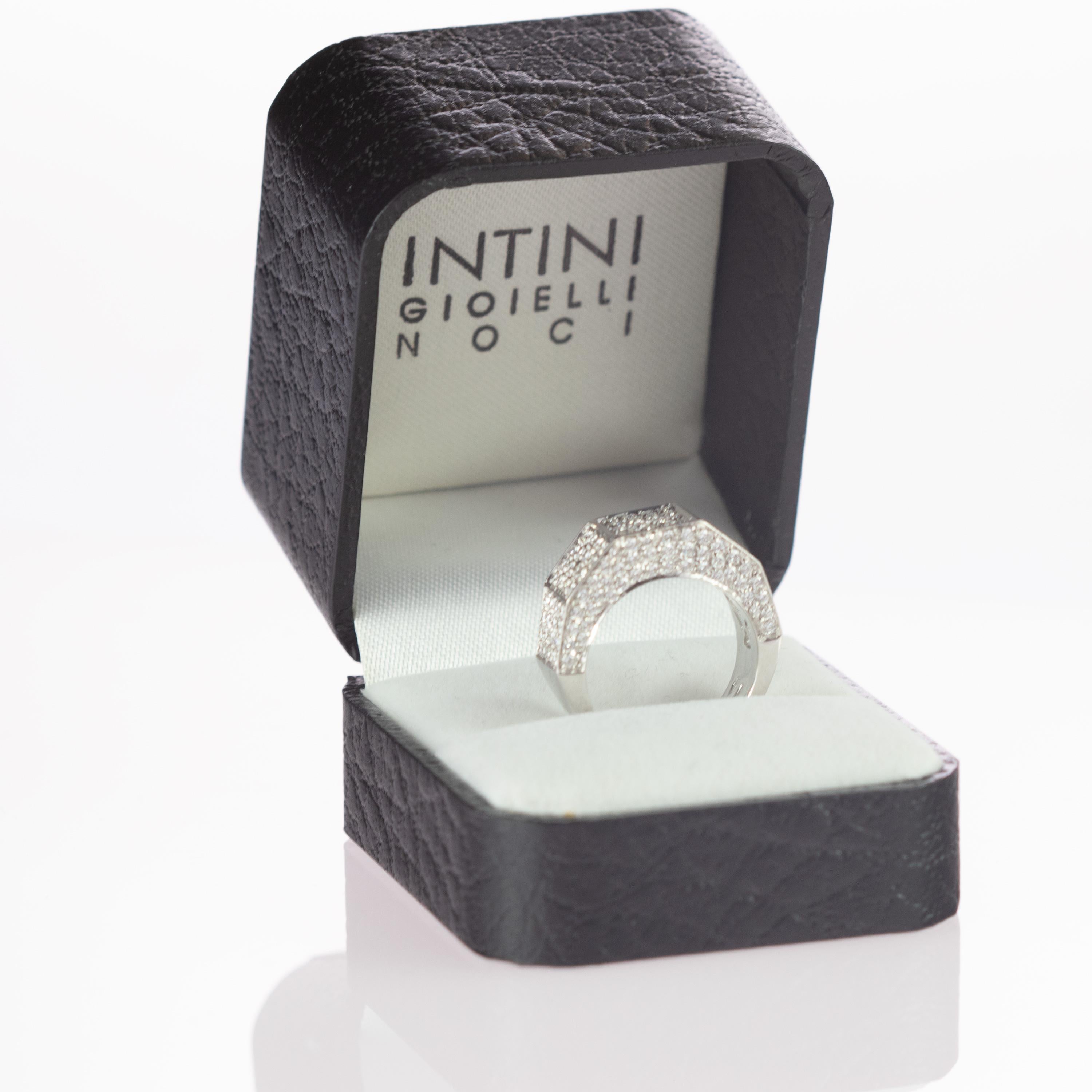 Rare and magnificent band ring with 1.57 diamond carats, helded in a 18 karat white gold. The ring has an exquisite and glamorous geometric design of a cluster of brilliant cut diamonds
 
At intini all our jewels have a personality and a story