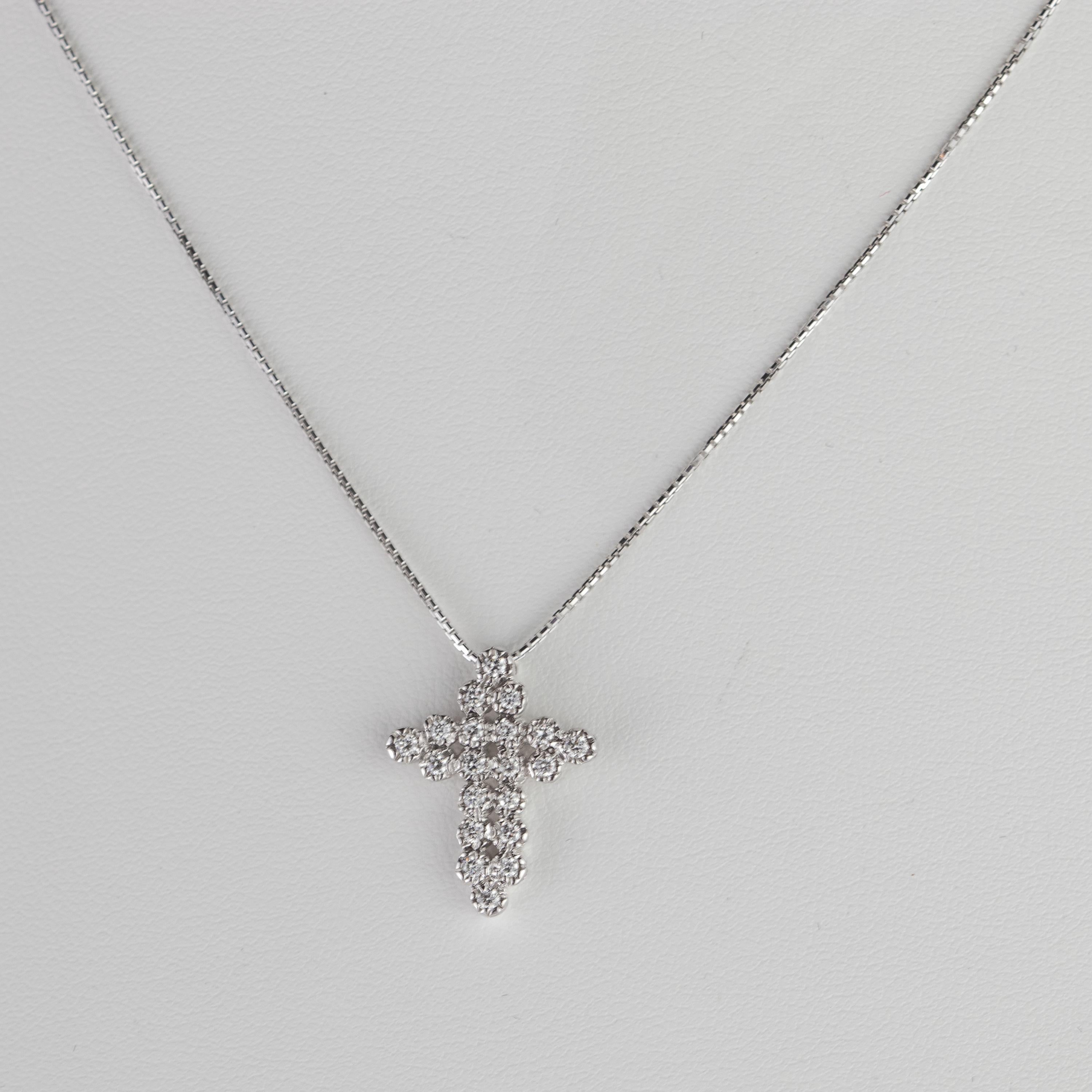Handmade sparkling and delicate cross pendant necklace. A beautiful and delicate cross made of 1.6 carats of top quality diamonds softly woven with a luxury design. 20 gems create a unique pendant full of light and glamour. Holded by a 18 karat