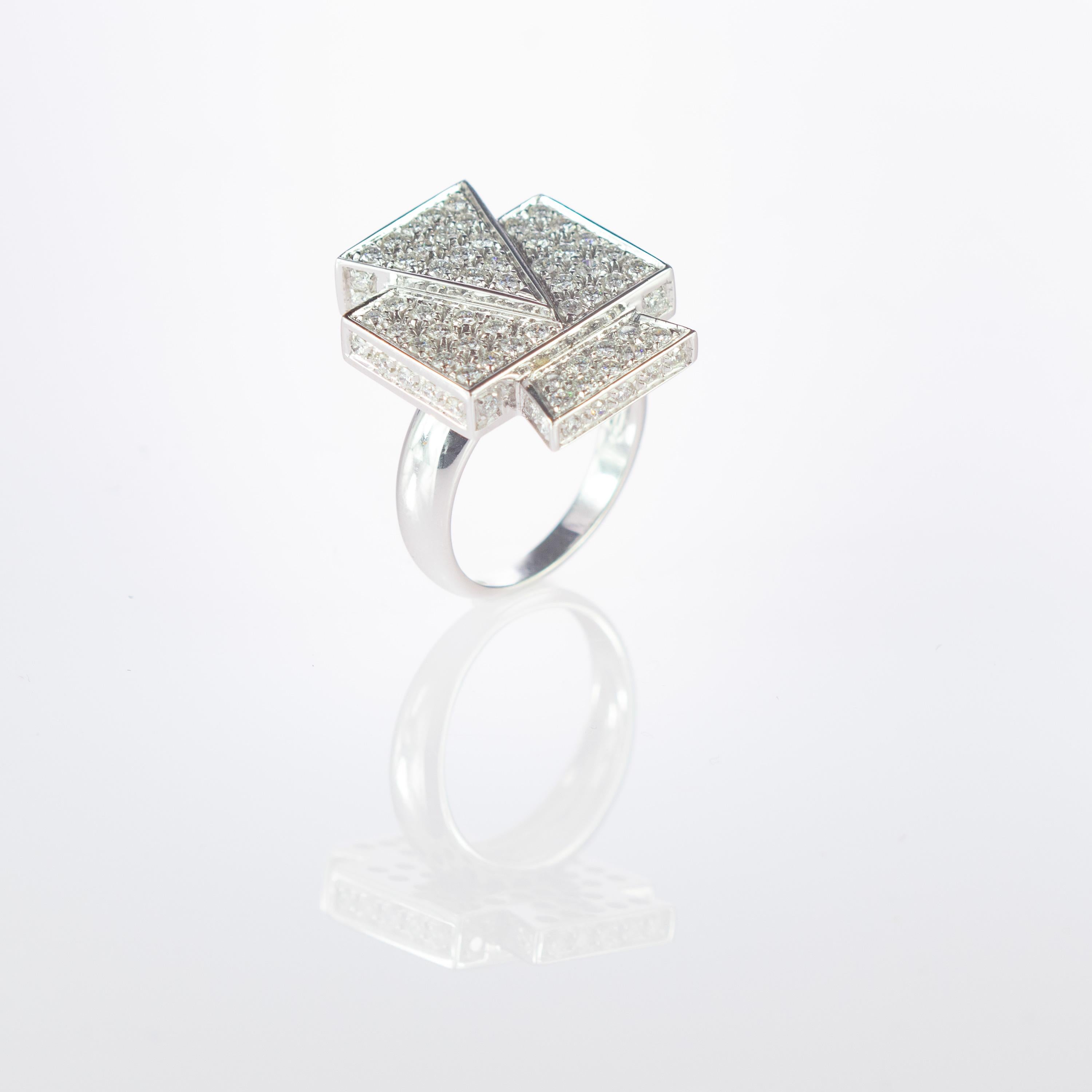 Mysterious and mystical italian design with 1.69 carat brilliant cut diamond shape setted in smooth 18 carat white gold ring. This design represent a geometric style full of immagination and glamour. A tringle and  rectangle melt into a paradise