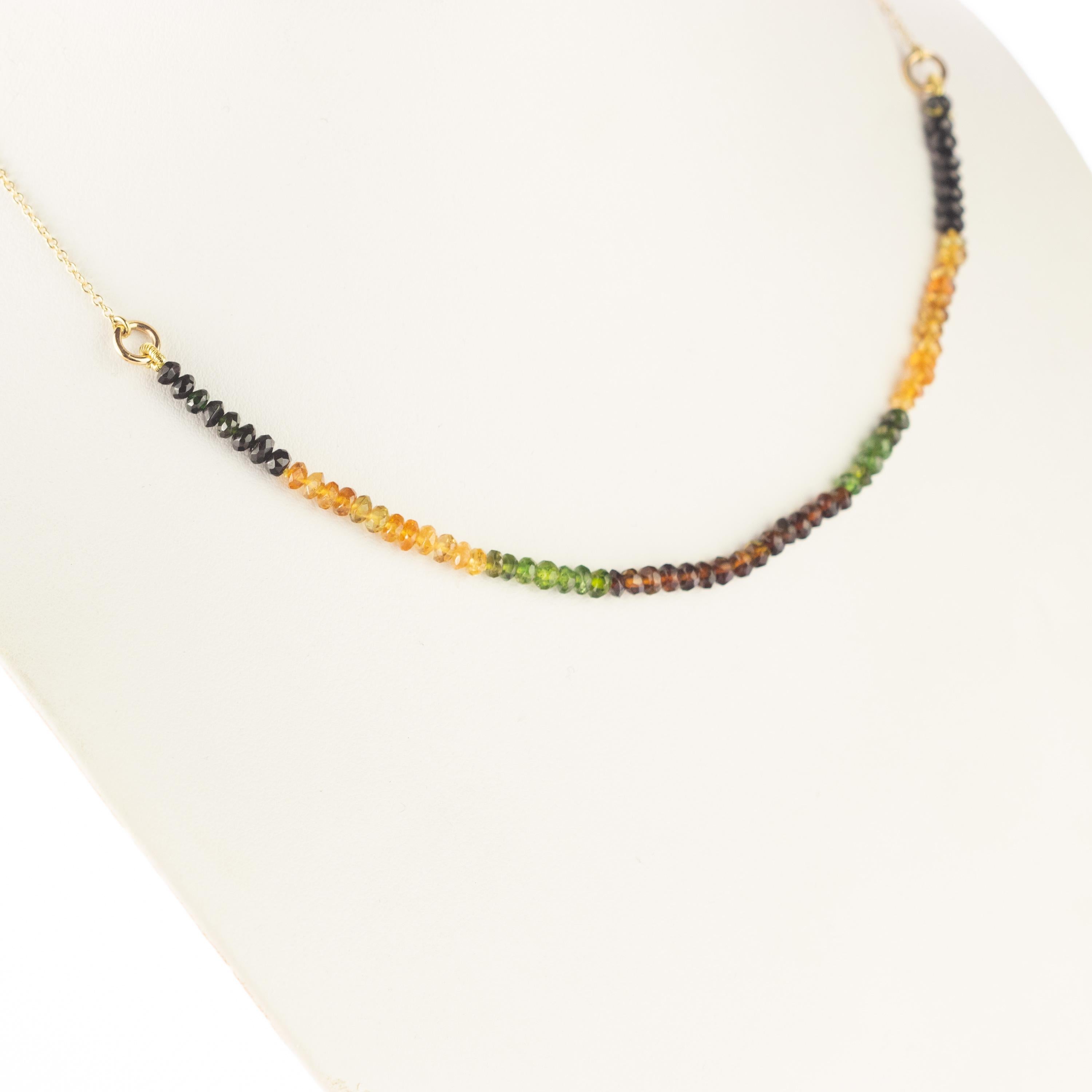 Marvellous necklace starring pure tourmaline green, yellow, brown and black rondelle gems, for a bright charm of uniqueness. Luminous jewel with natural precious jewellery on elegant 18 karat yellow gold setting. 
 
Ancient beliefs say that we