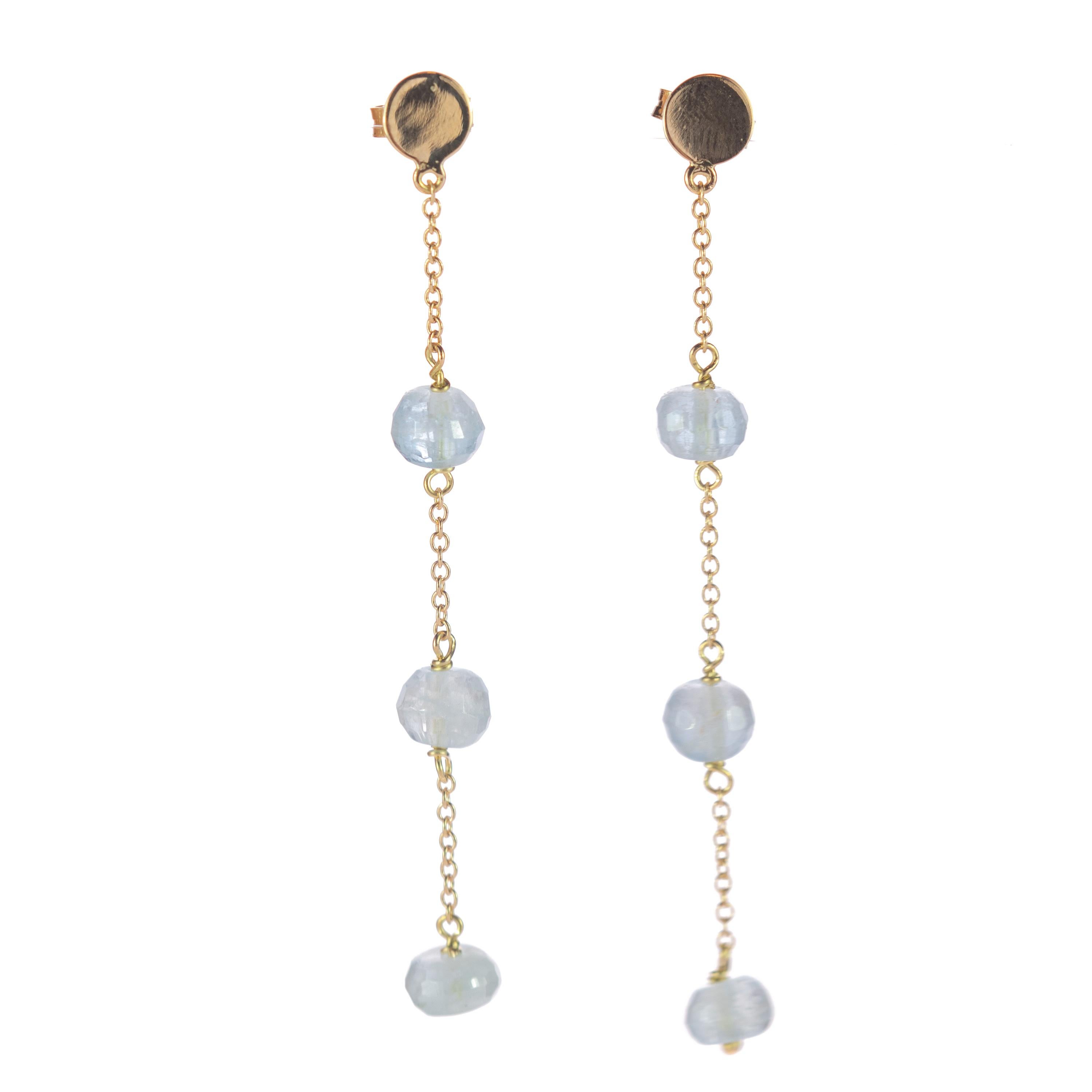Intini Jewels signature quality on a modern and contemporary design jewel. Stunning earrings with three aquamarine rondelles embellished in a 18 karat yellow gold chain.

An elegant touch of glamour at your fingertips. Let yourself be tempted by a