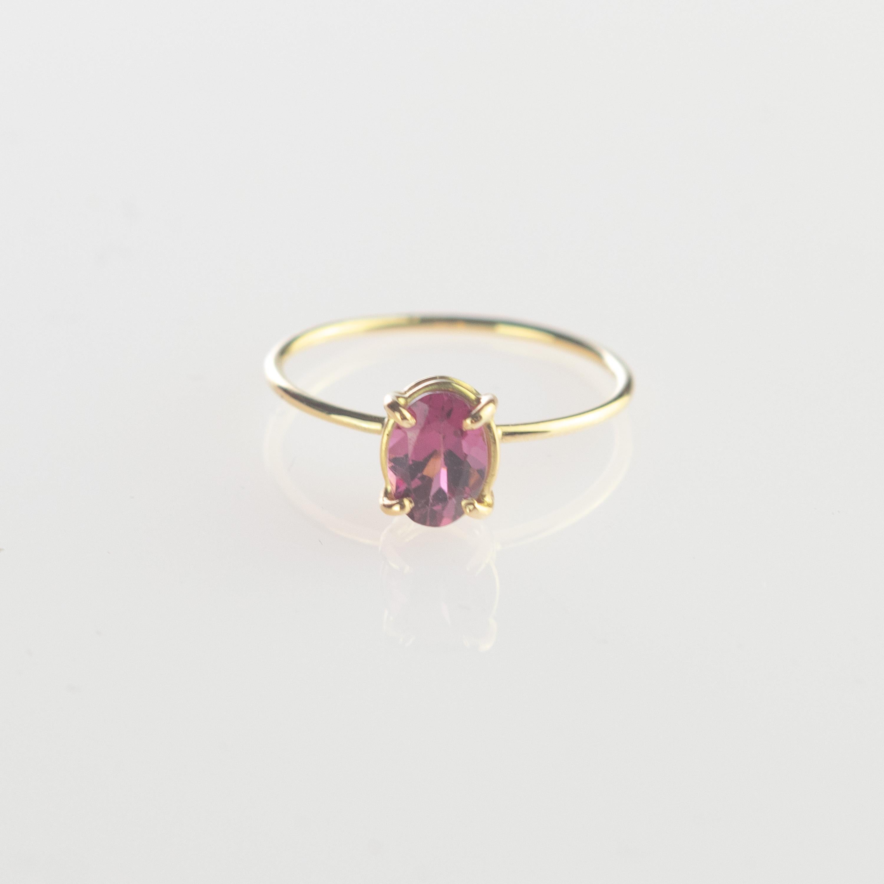 Oval cabochon solitaire ring design, with shining sparkles. 0.5 carat Rubellite on 18 karat yellow gold ring inspired by the joy of summer sunsets. With a perfect size, it will fill with your daily elegant outfits.

You will be impressed by its