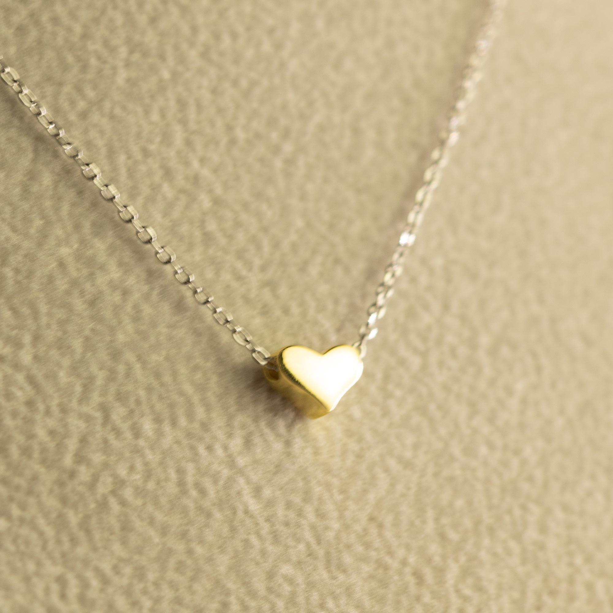 Precious and delicate Heart shaped pendant hanging from a delicate White Gold chain. 
Romantic jewellery for an everyday graceful gift.

• Sterling Silver Chain Necklace
• Gold FilledHeart shape pendant 0.7 x 0.5 cm
• Total Length 42 cm
• Total