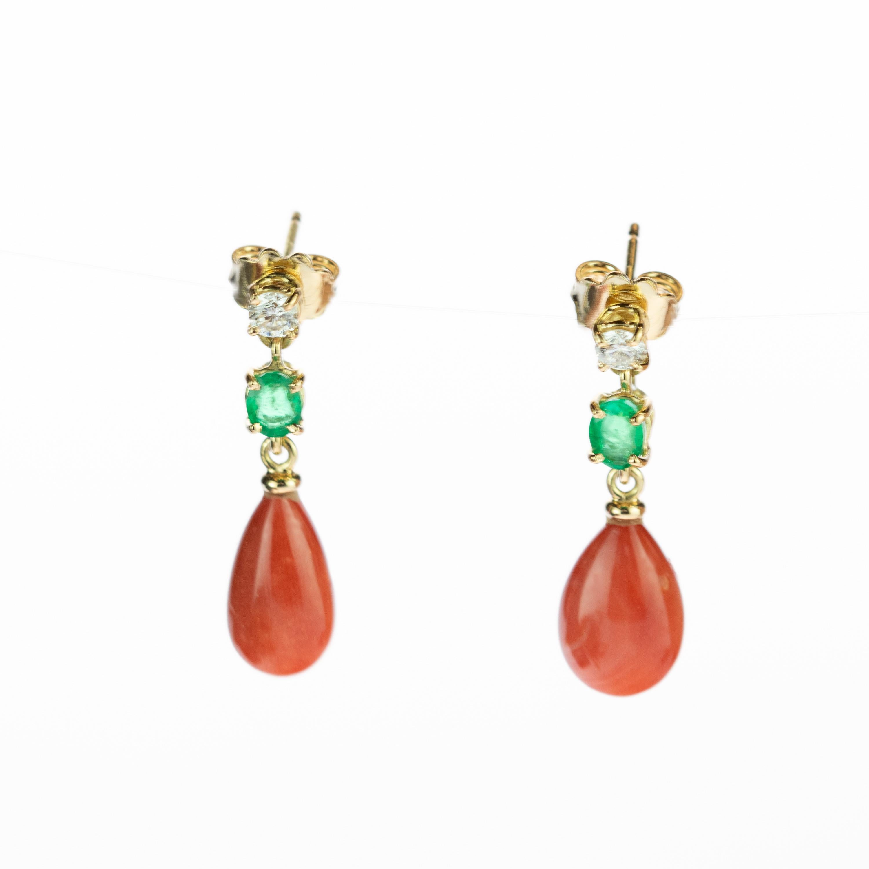 Gorgeous and glamorous bright salmon coral bold tears with diamonds and emerald earrings surrounded by delicate 18 karat yellow gold details. Drop and cocktail earrings evoking all the italian tradition resulting in a stunning masterpiece with an