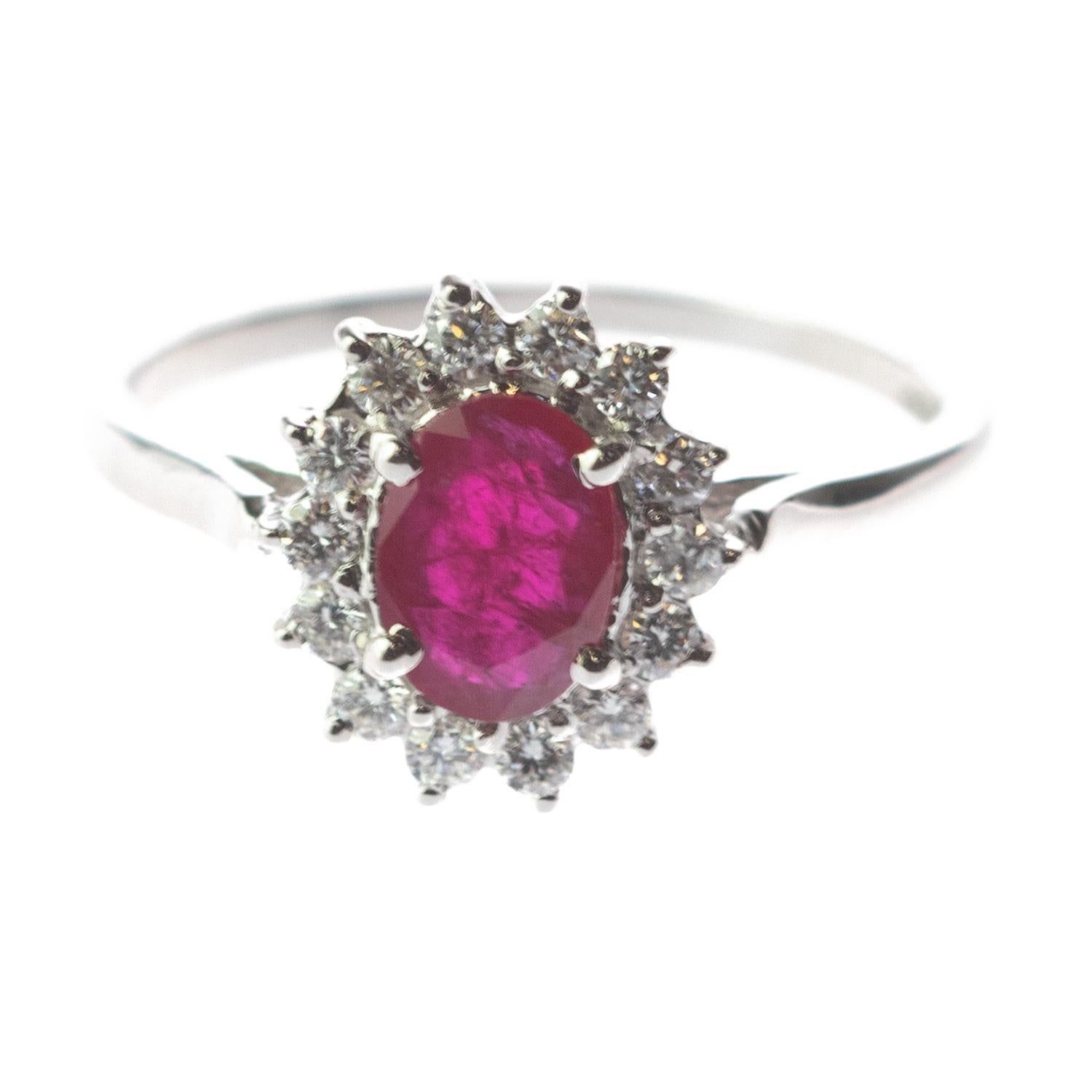 A stunning oval faceted Ruby ring enhanced by 18 karat white gold with diamonds. These epic jewellery pieces are an outstanding display of quality and Italian handmade royal craftsmanship. Create a fashionable look full of light and desire. This