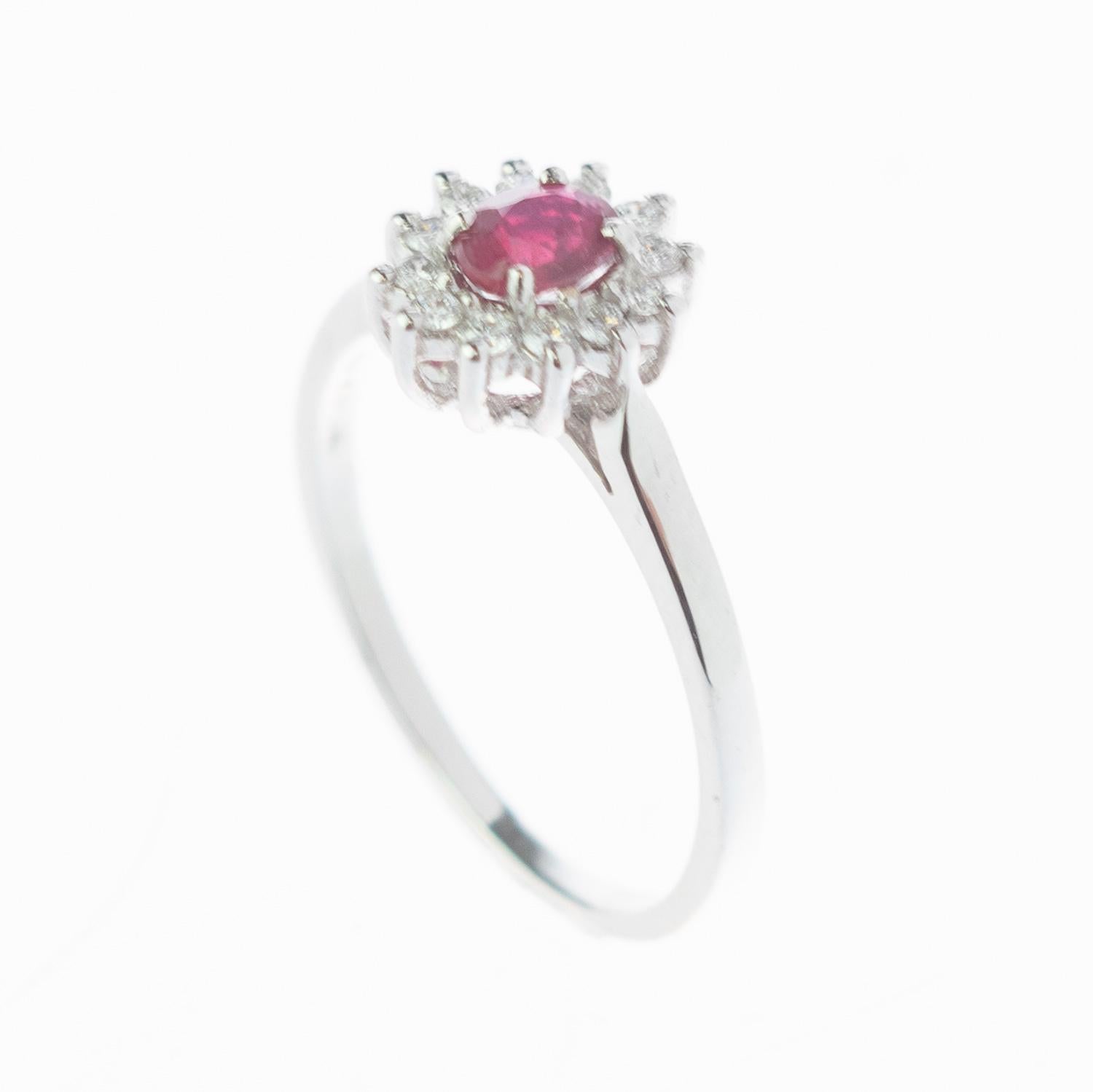 A stunning oval faceted Ruby enhanced by 18 karat white gold with diamonds. These epic jewellery pieces are an outstanding display of quality and Italian handmade royal craftsmanship. Create a fashionable look full of light and desire. This ring