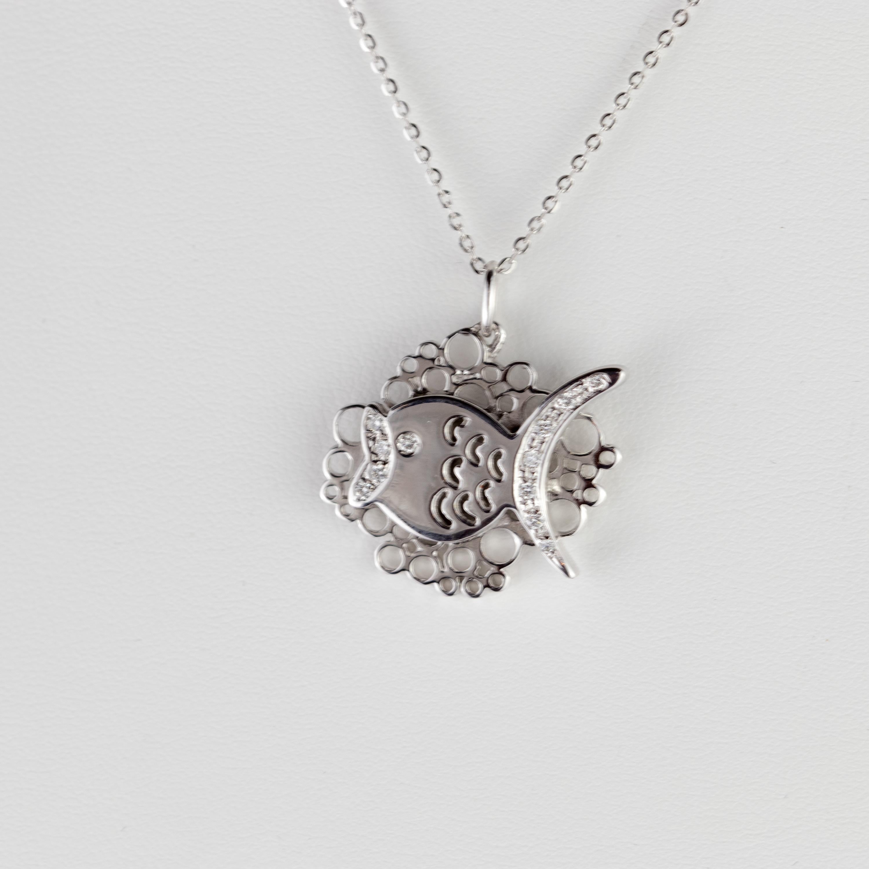 Elegant, modern and minimalistic one-of-a-kind necklace with a white gold carved fish pendant. Handmade jewels that highlight a magnificent creature with diamonds decorating its eye, mouth and fins with a total of 0.18 carat diamonds. Setted in a