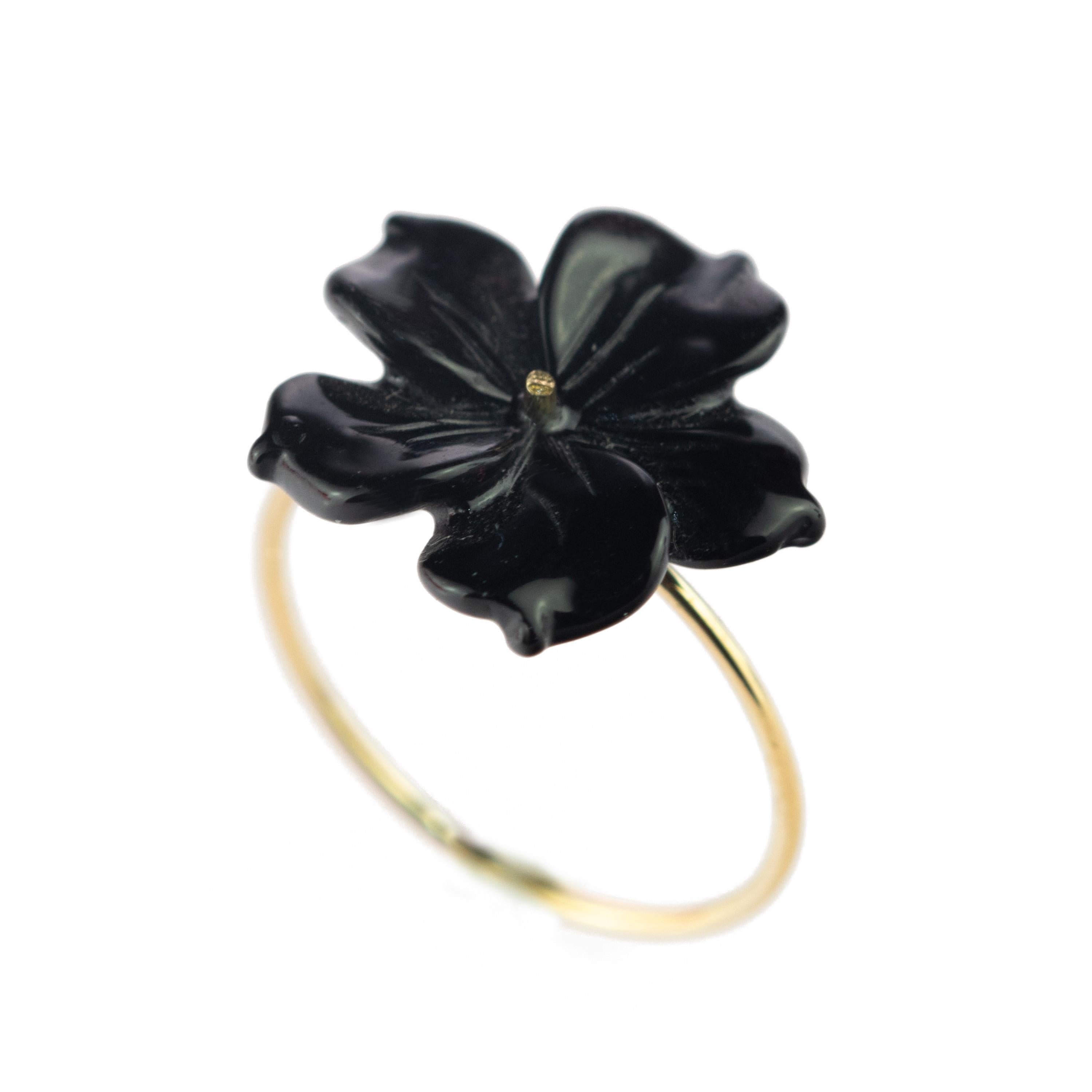Astonishing and delicate 3.5 carat black agate flower ring. Carved petals that evoke the italian handmade traditional jewelry work, wrapping itself in a soft look enriched with 18 karat yellow gold manifesting glamour and exquisite taste. Cocktail