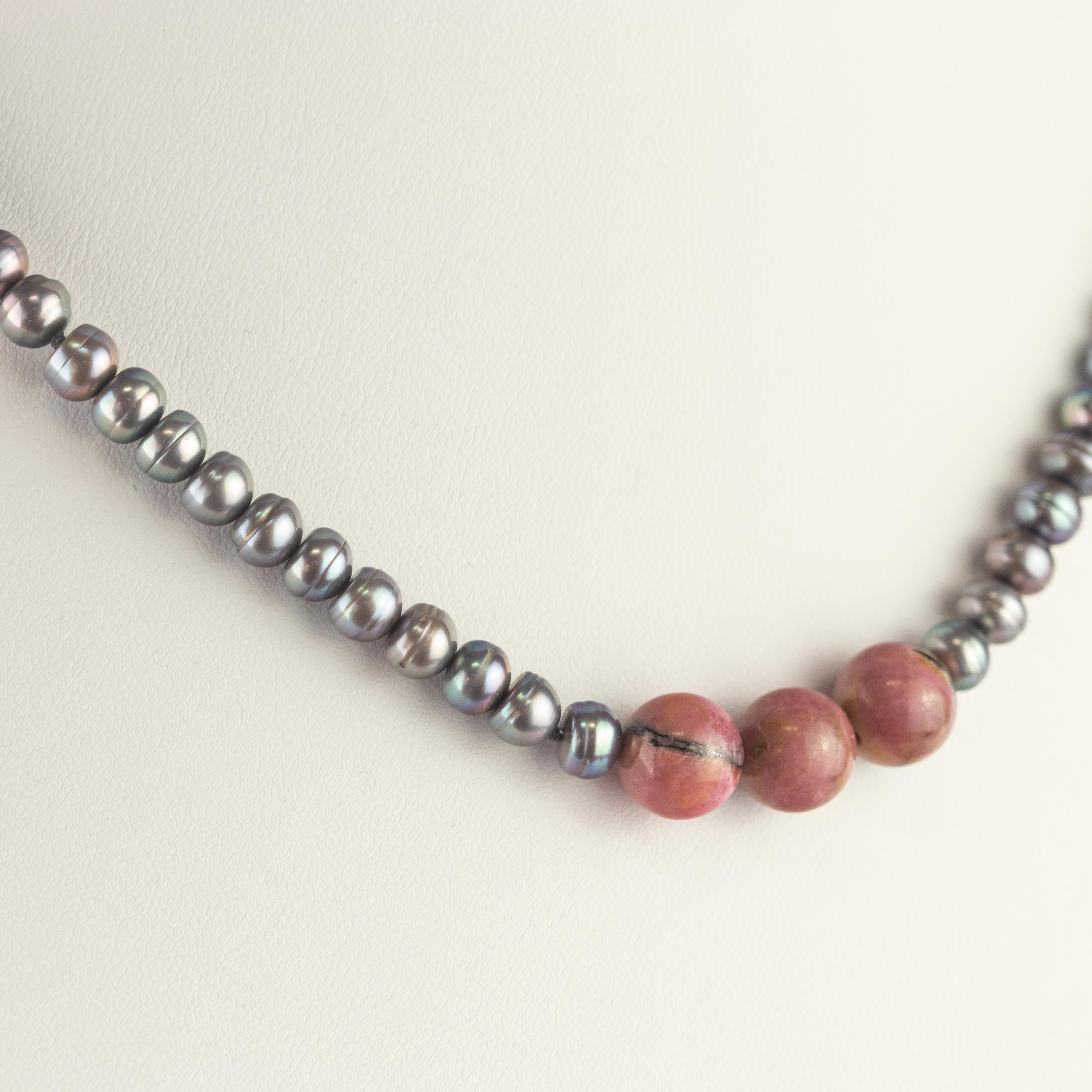 A timeless design meets charming rhodonite. Top quality materials for a Made in Italy iconic necklace. First class freshwater pearls with an elegant closure in 18k yellow gold.

Pearls are thought to offer the power of protection, luck, money and