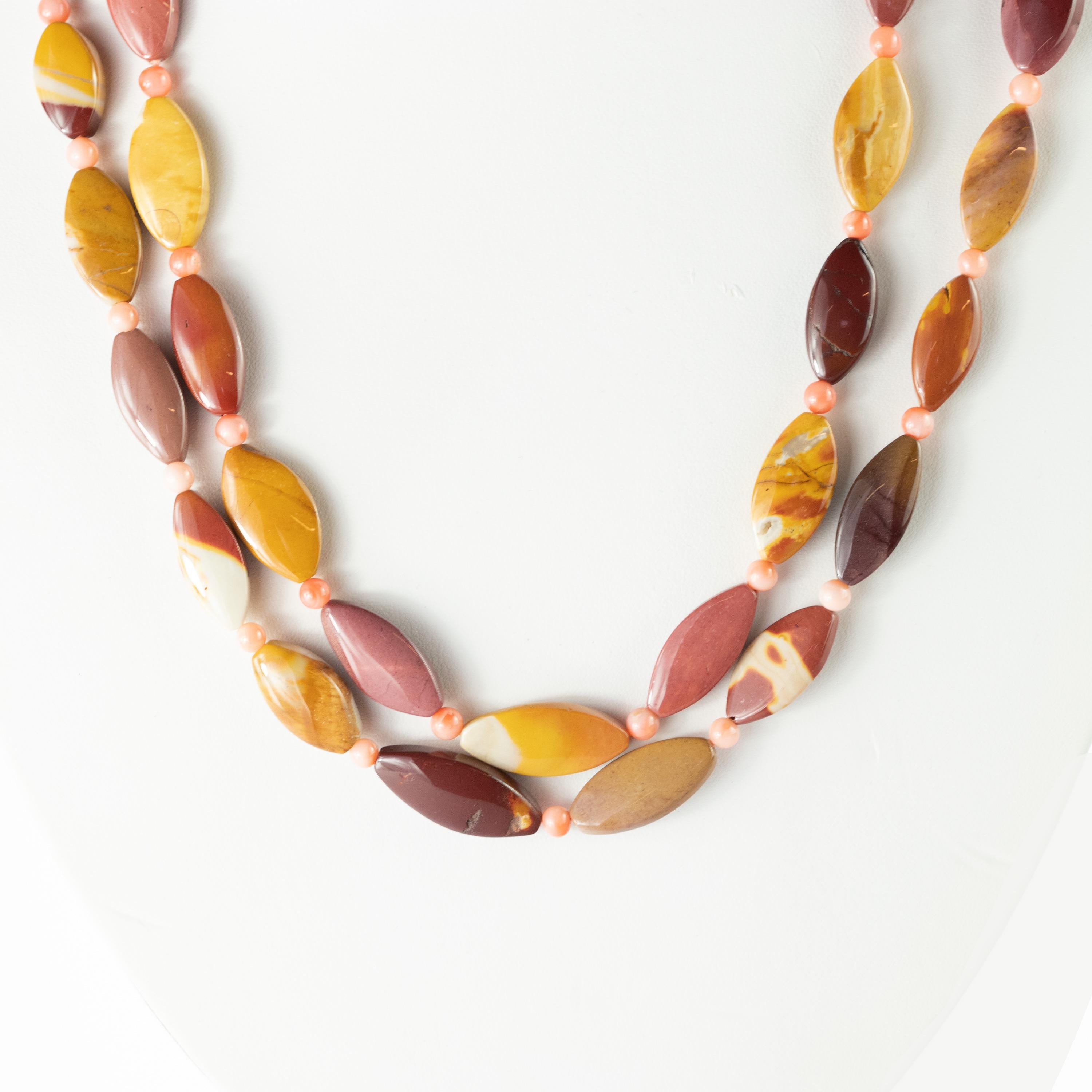 Mokaite jasper interspersed with pink coral melted into a fabulous beaded and boho design. A fashionable wrap around style that managed to give life to a young and passionate jewel. This epic statement necklace is an outstanding display of color and