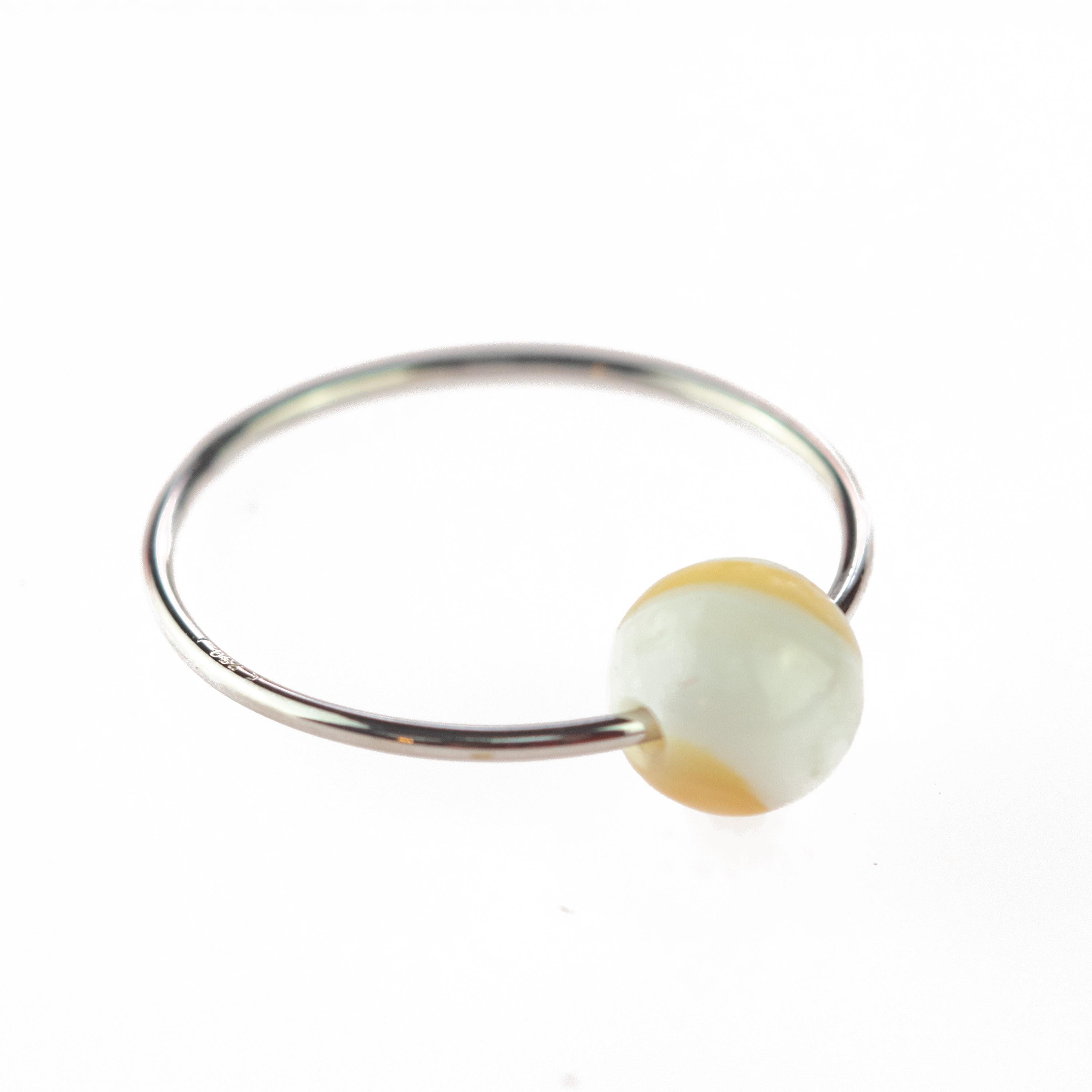 Signature INTINI Jewels Planet ring. Contemporary ring design in 18 karat white gold with a precious mother of pearl round bead.  Passion and intensity mixed in one jewel. Delight yourself with a strong, minimalist design, just for a stunning chic