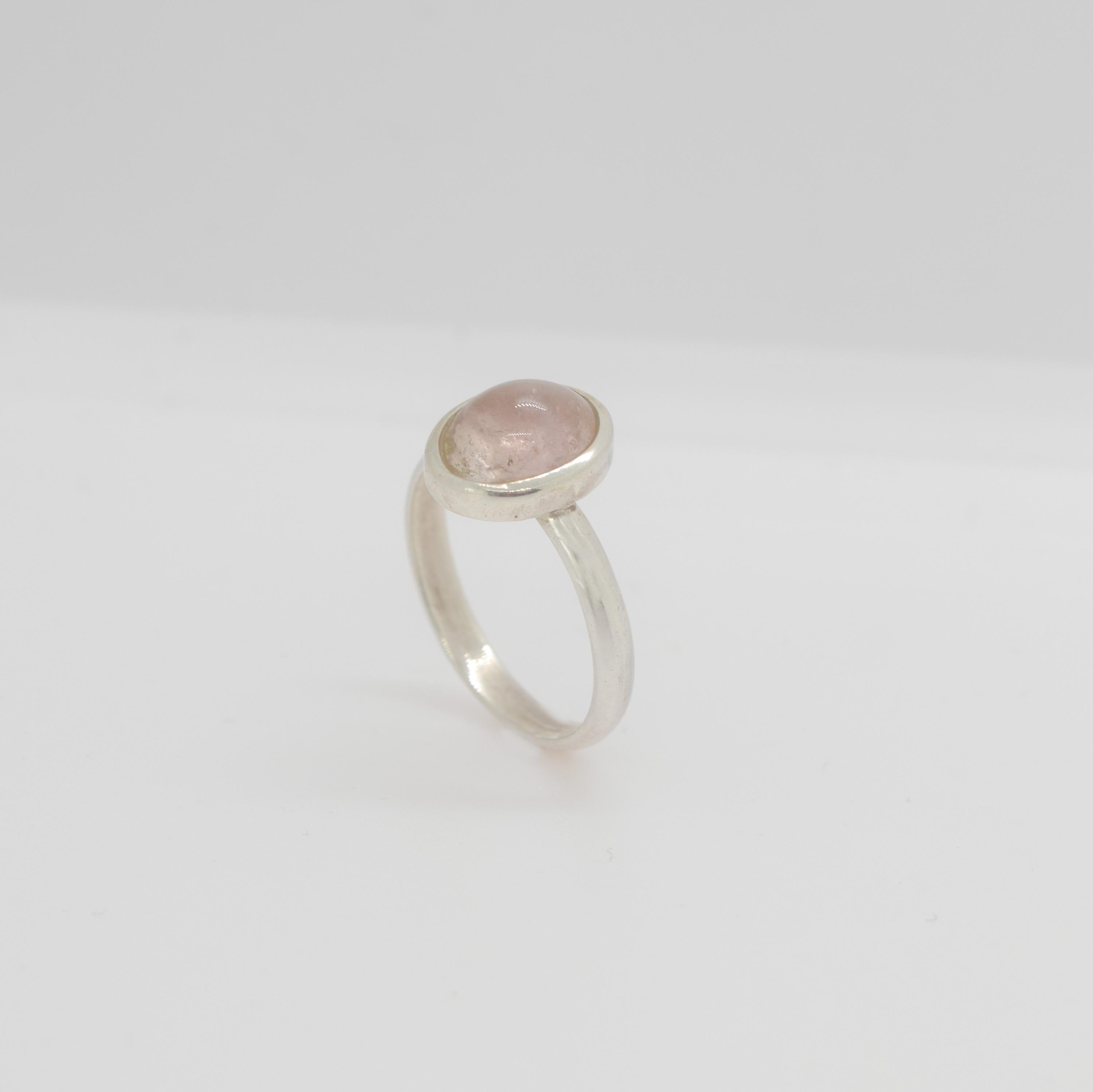 Pink tourmaline gemstone with an oval cabochon design embellished in a sterling silver ring. This gem will fill your daily elegant outfits with a modern and simple design. The pink tourmaline ​​represents the stone of love and growth, delight