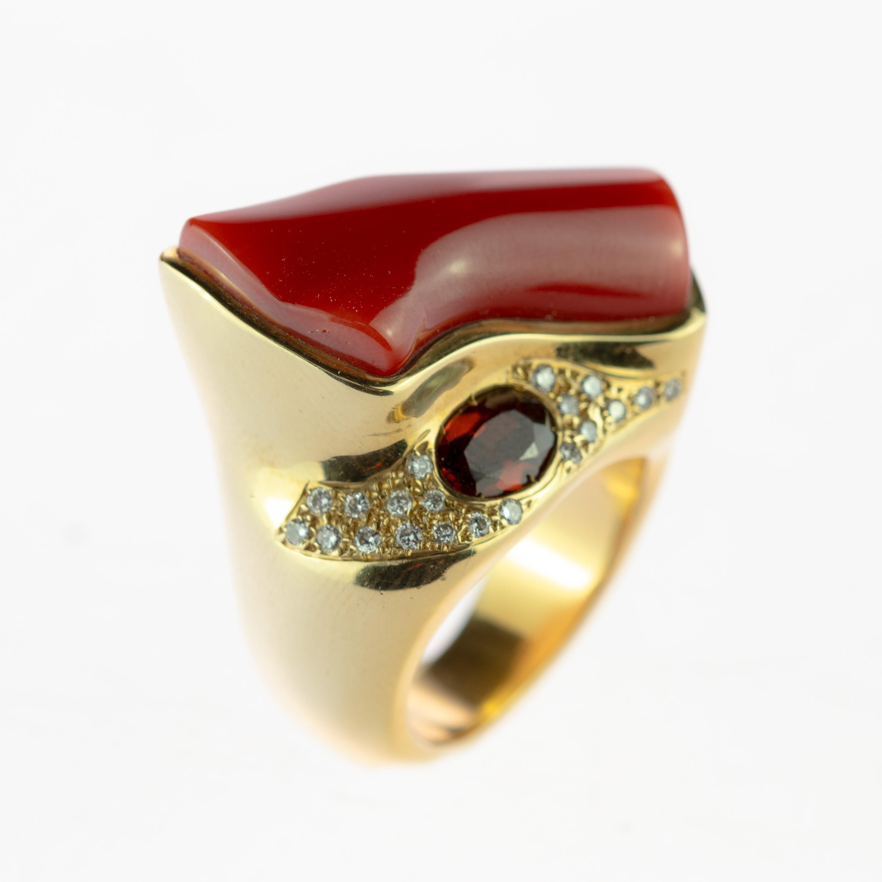 Rare and magnificent natural coral and 2 carats almandine garnet gem surrounded by a mixed yellow gold ring embellished with 0.22 carats diamonds. This sublime design is inspired by the healing powers of the three gems, making sure the mind, body