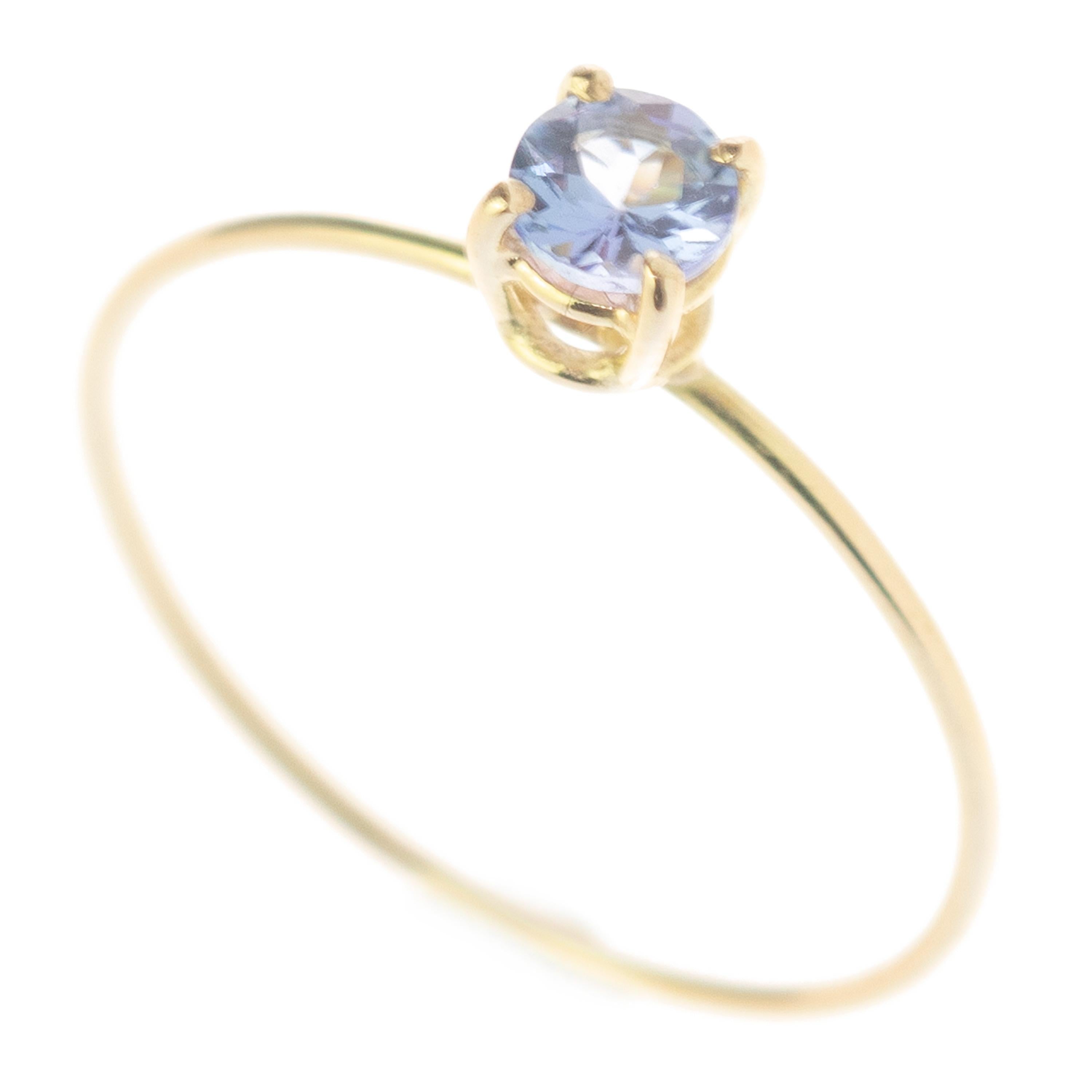 Signature INTINI Jewels clear blue tanzanite jewellery. Modern and elegant ring design in 18k yellow gold with an brilliant cut with tiny griffes sormounting the ring.

This gorgeous blue-purple gemstone is linked to various positive and mystical