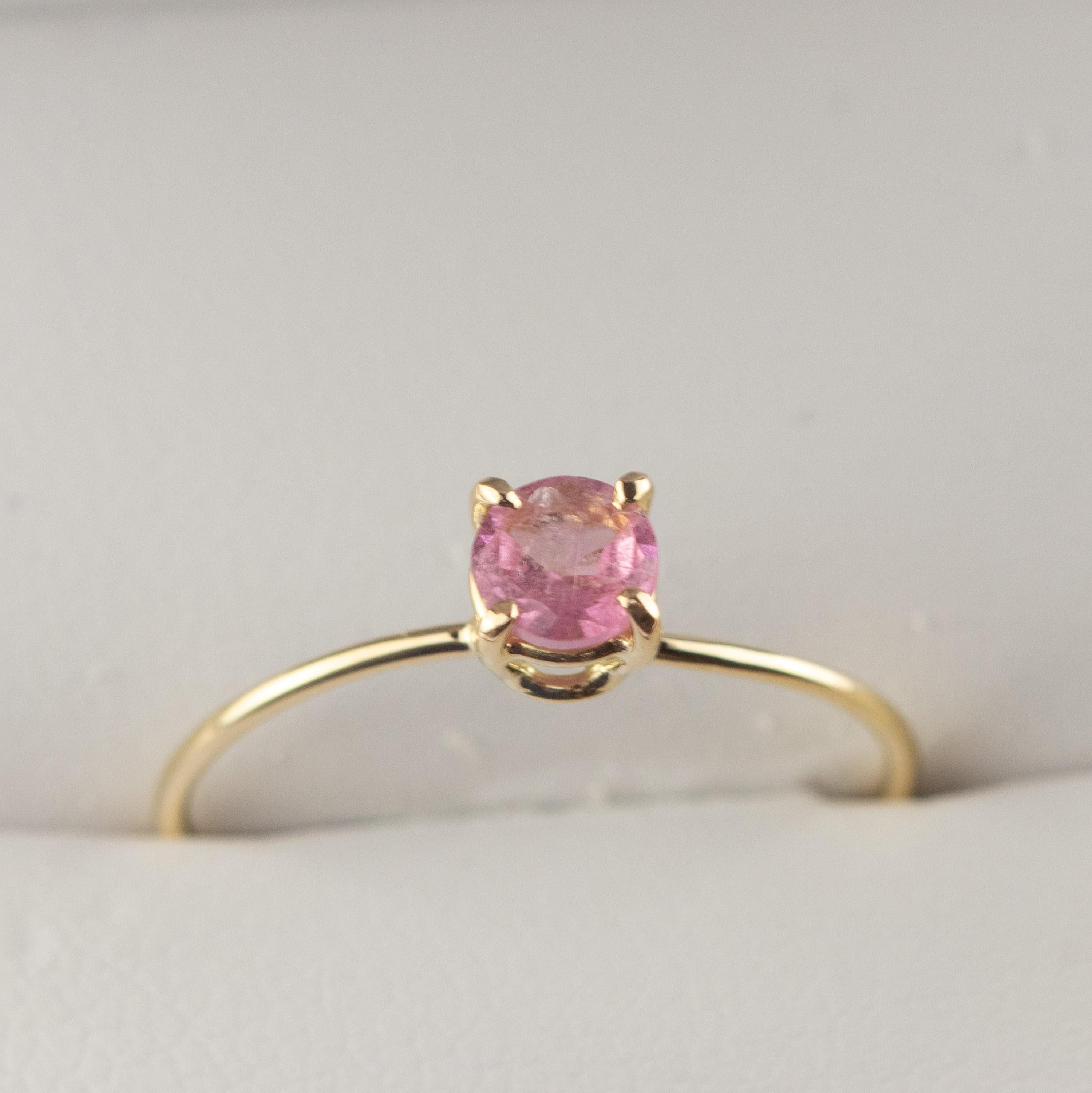 Signature INTINI Jewels pink tourmaline jewellery. Modern and elegant ring design in 9k yellow gold with an brilliant cut with tiny griffes sormounting the ring. Handmade, delicate and modern chic ring.

Pink Tourmaline is a gemstone that can break