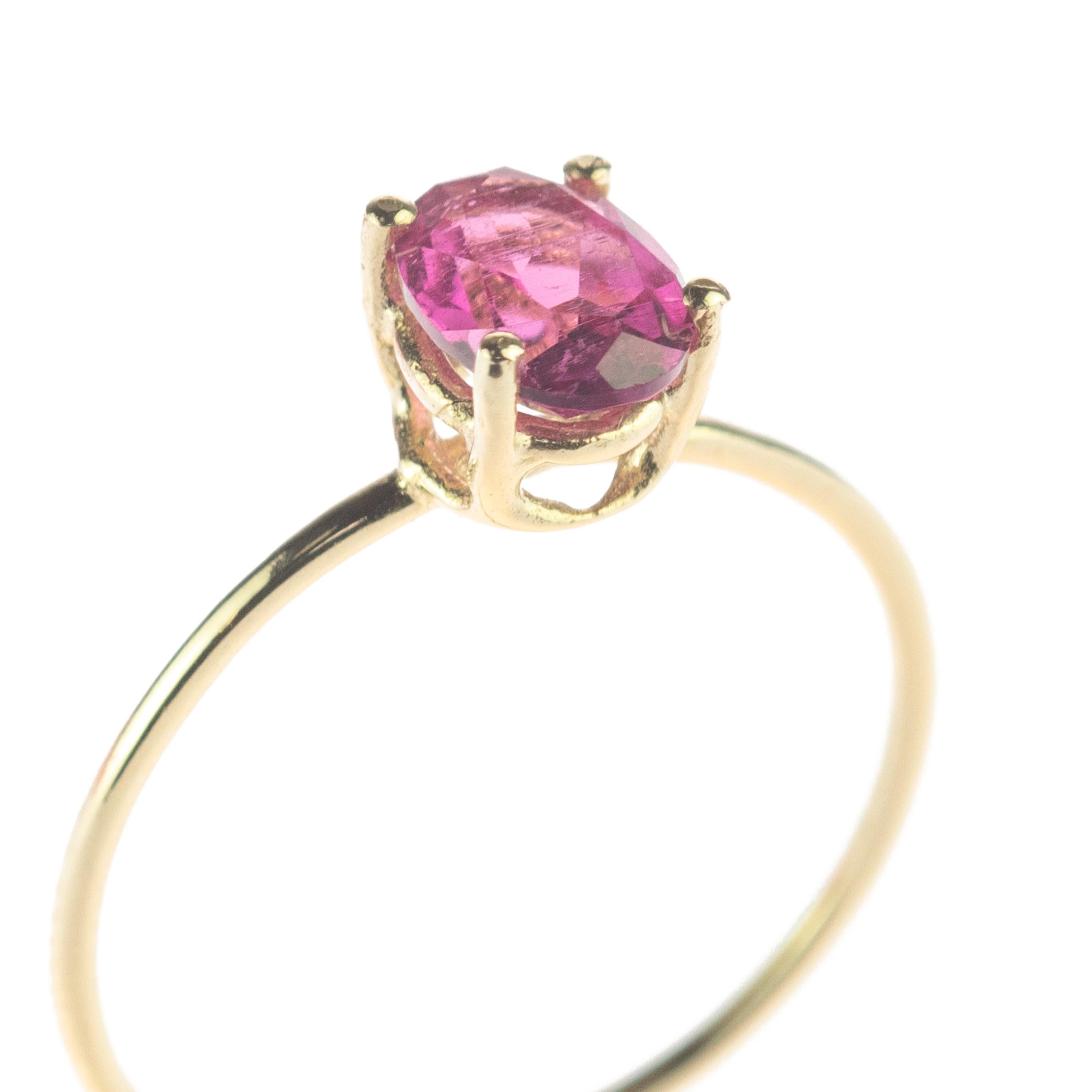 Signature INTINI Jewels Tourmaline jewellery. Modern and elegant midi ring design in 14k yellow gold with an oval cut with tiny griffes sormounting the ring.

Tourmaline helps to create a shield around a person or room to prevent negative or